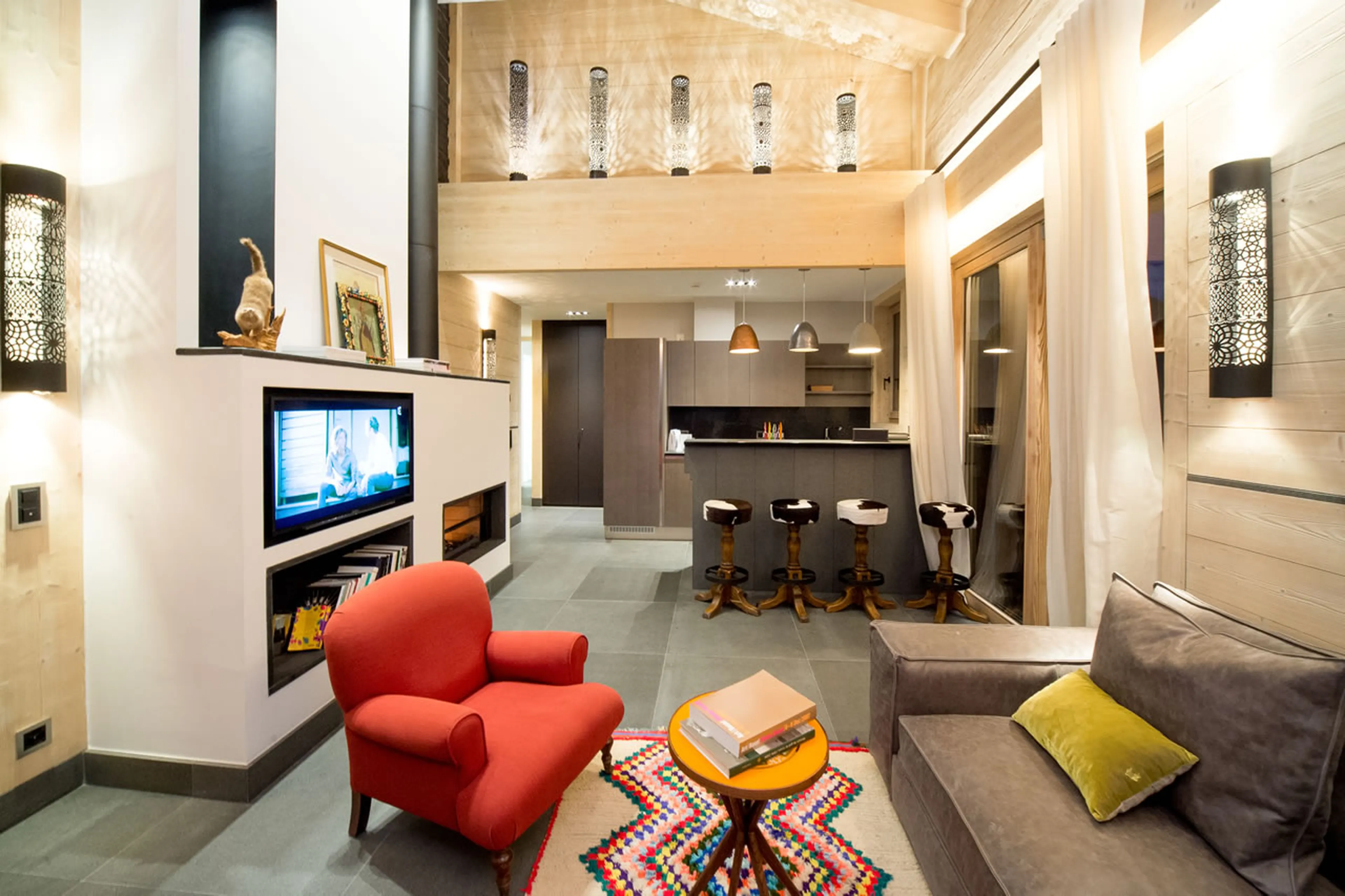 Apartment Bellalui in Chalet Migui in Crans-Montana with open-plan kitchen and breakfast counter