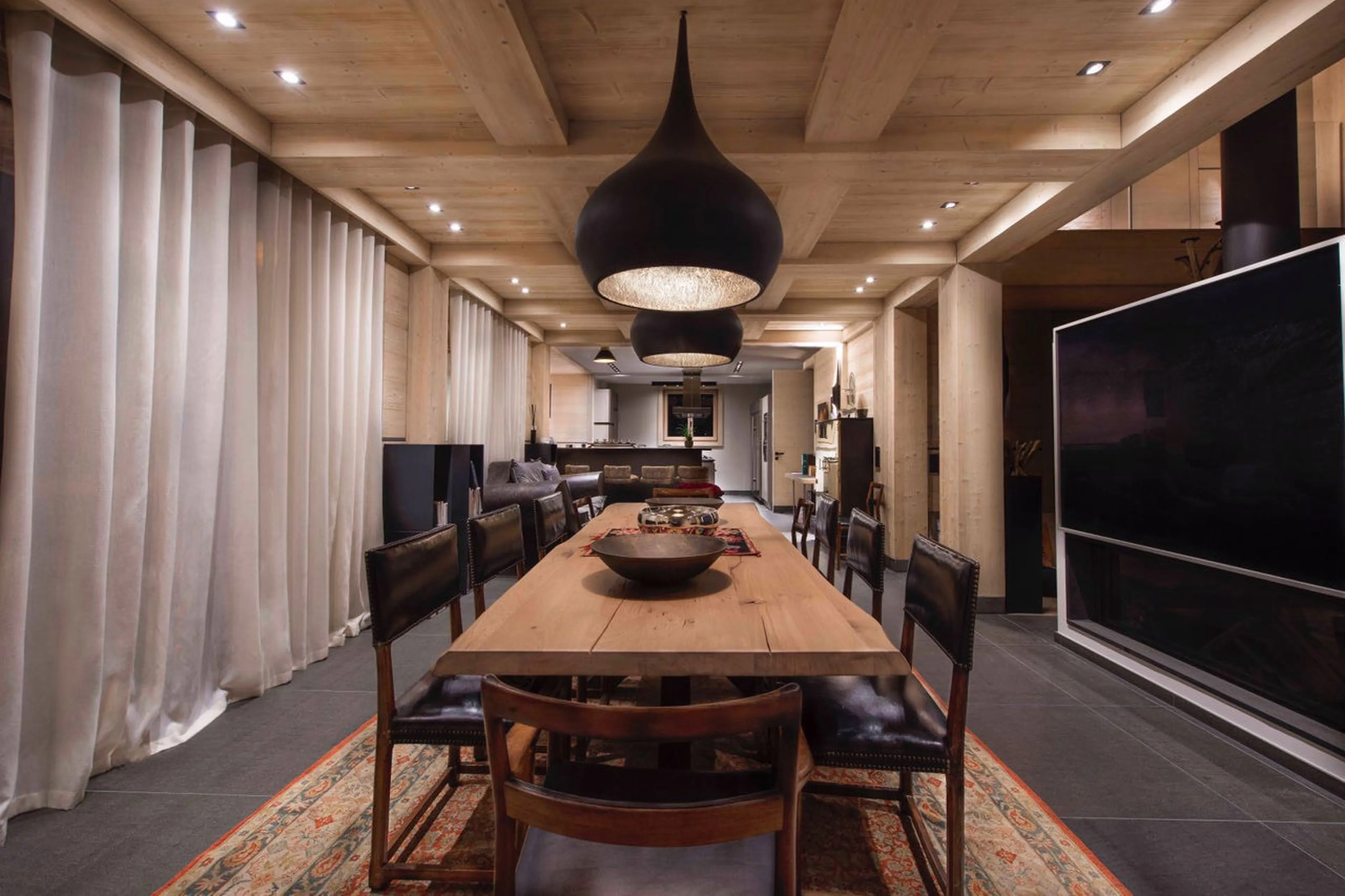 Dining room with balcony access in Chalet Migui in Crans-Montana