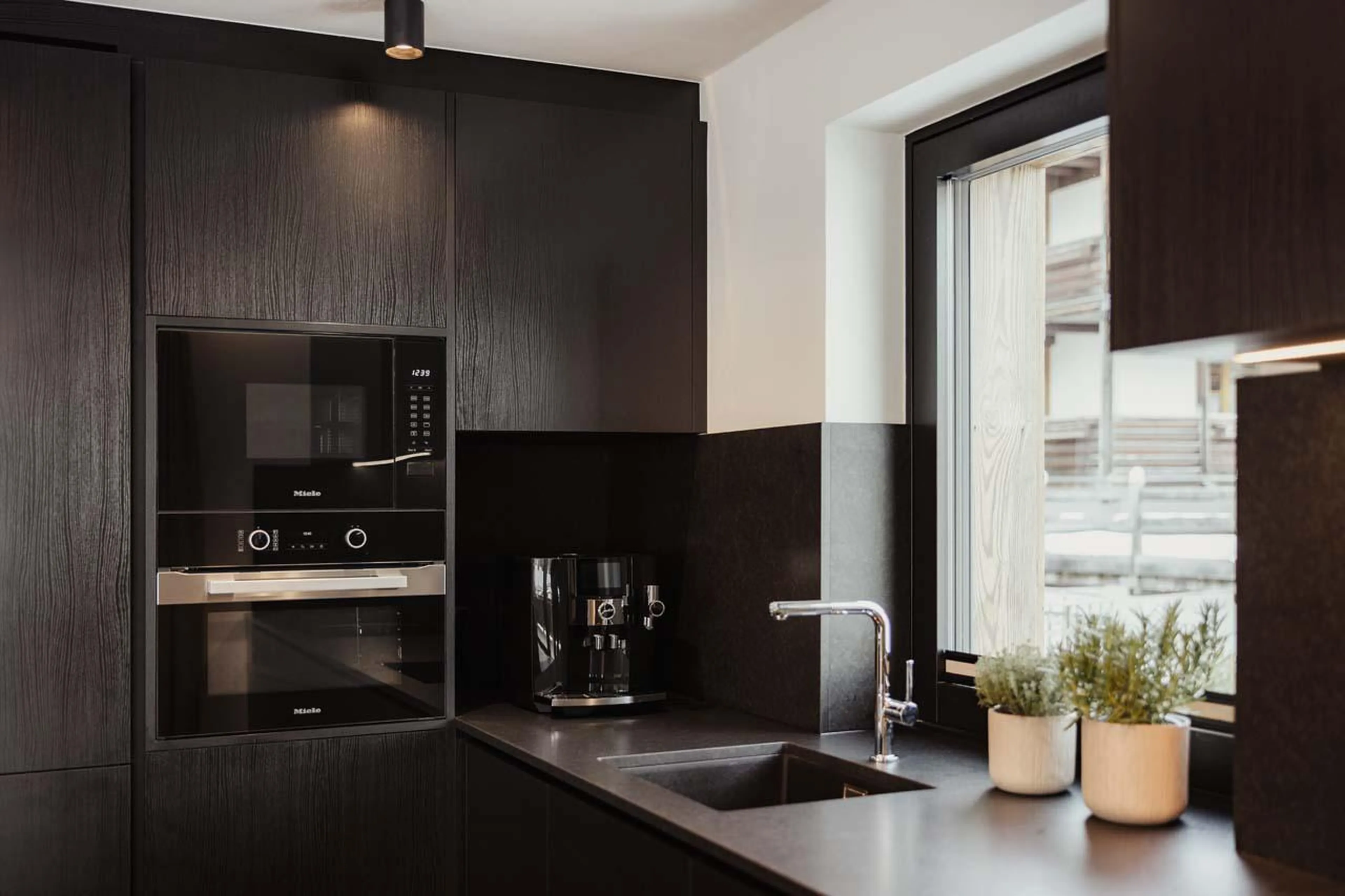 Inviting and sociable open-plan kitchen at Chalet Mile 2 in Val Gardena