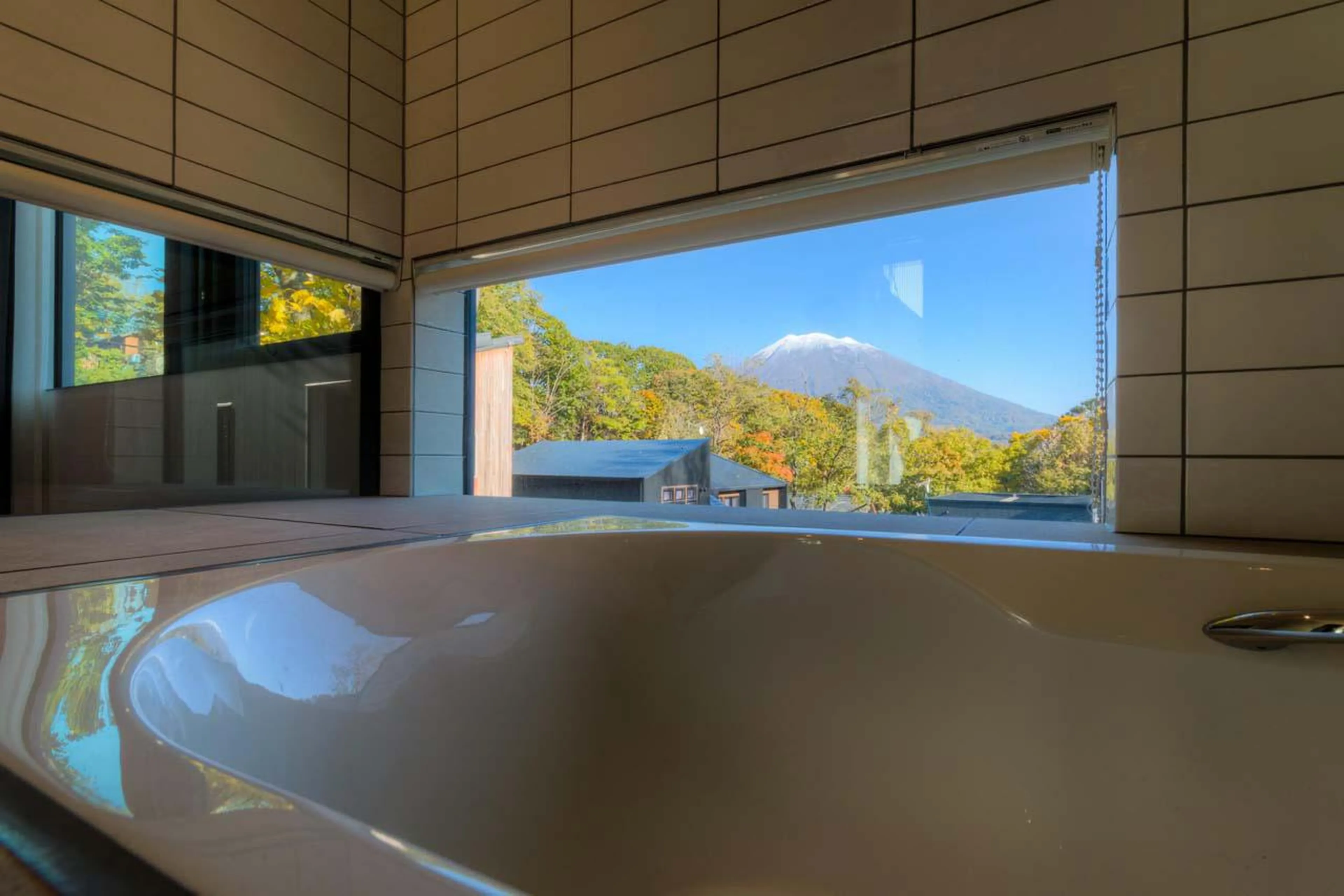 Bath offering views of Mount Yotei at Chalet Millesime in Niseko