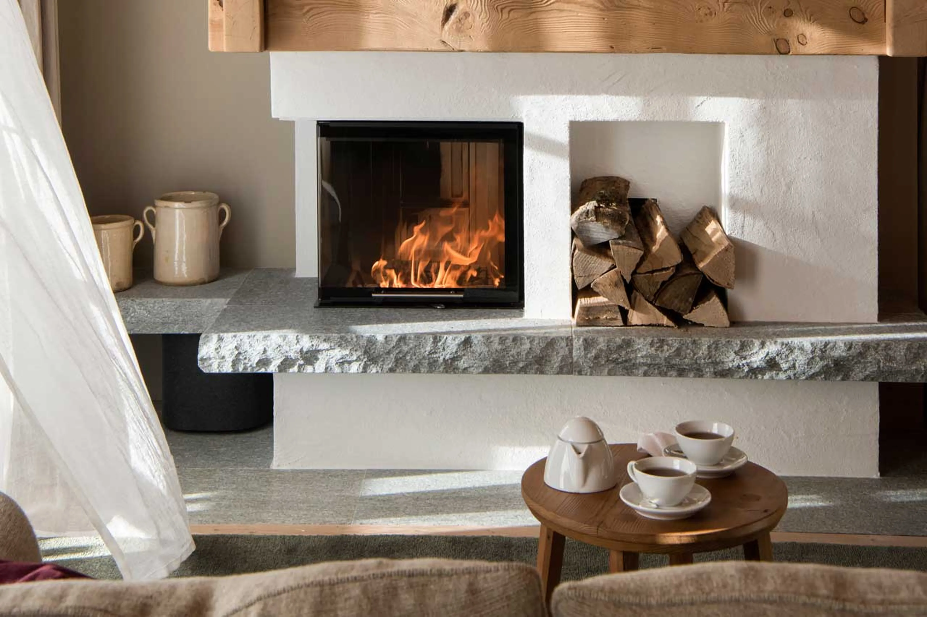 Fireplace in living room at Chalet Mimi in Oberlech