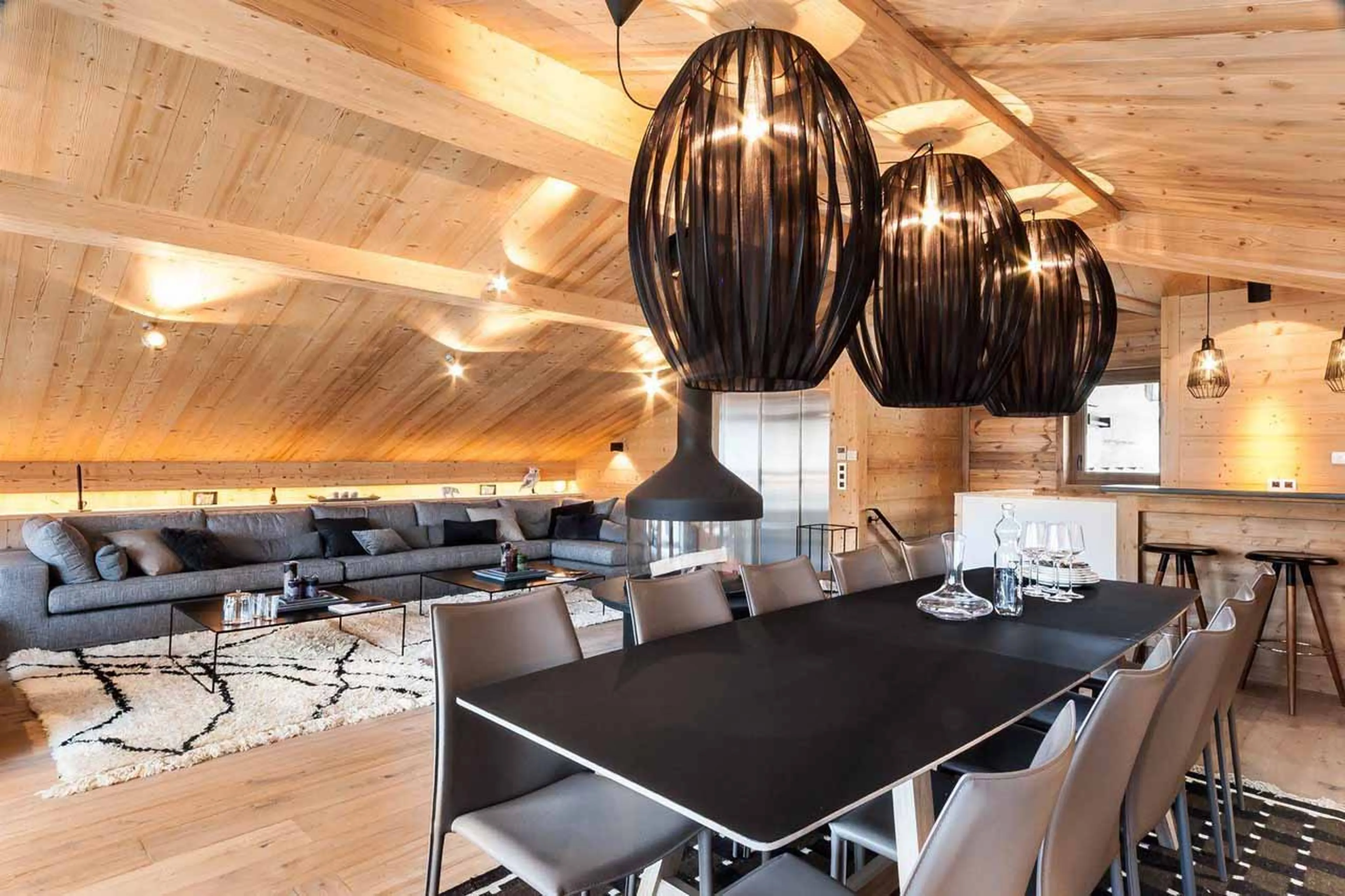Dining room and sofa area at Chalet Monch in Courchevel 1550