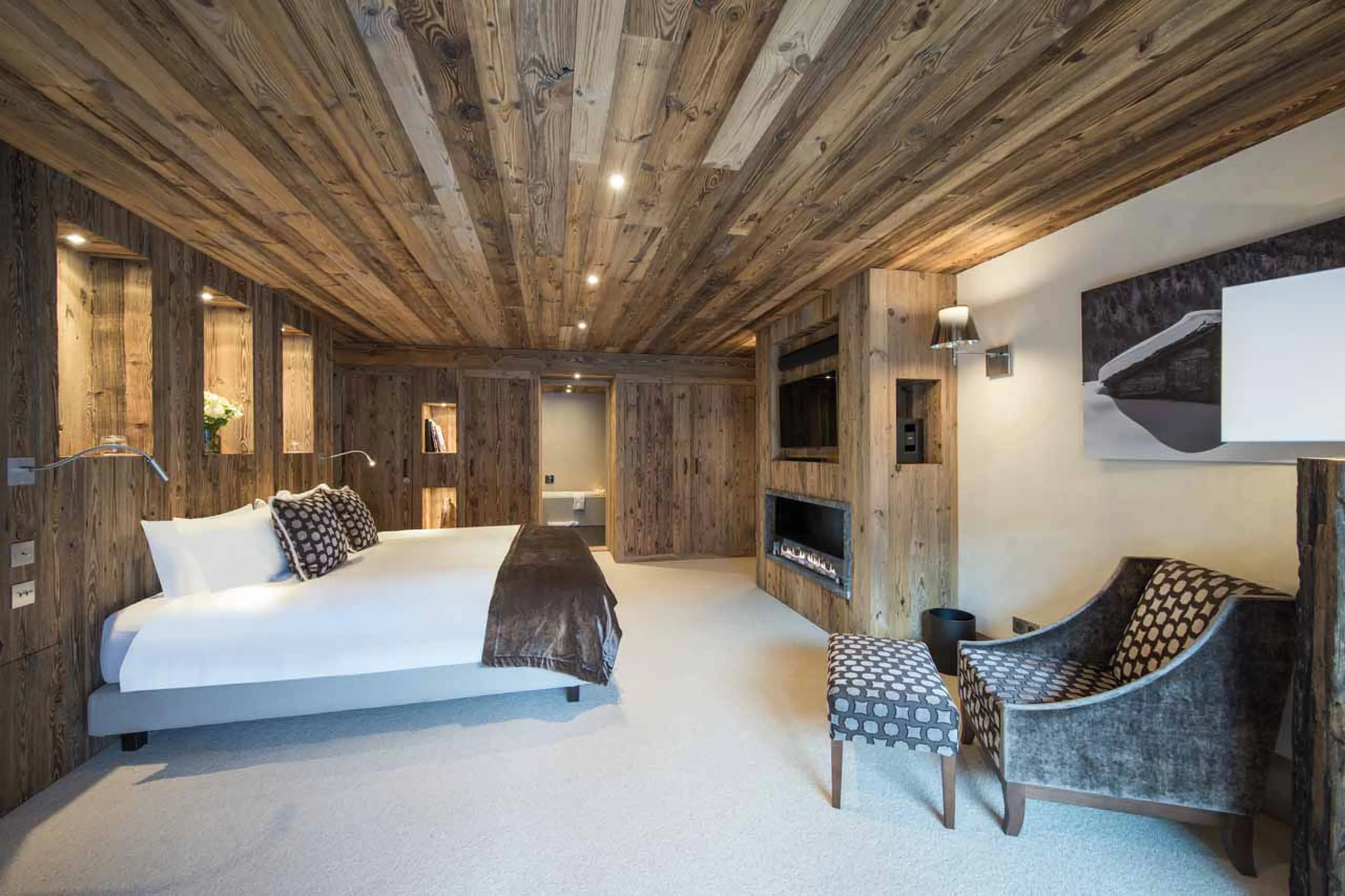 Fireplace and TV in bedroom two at Chalet Mont Tremblant in Meribel