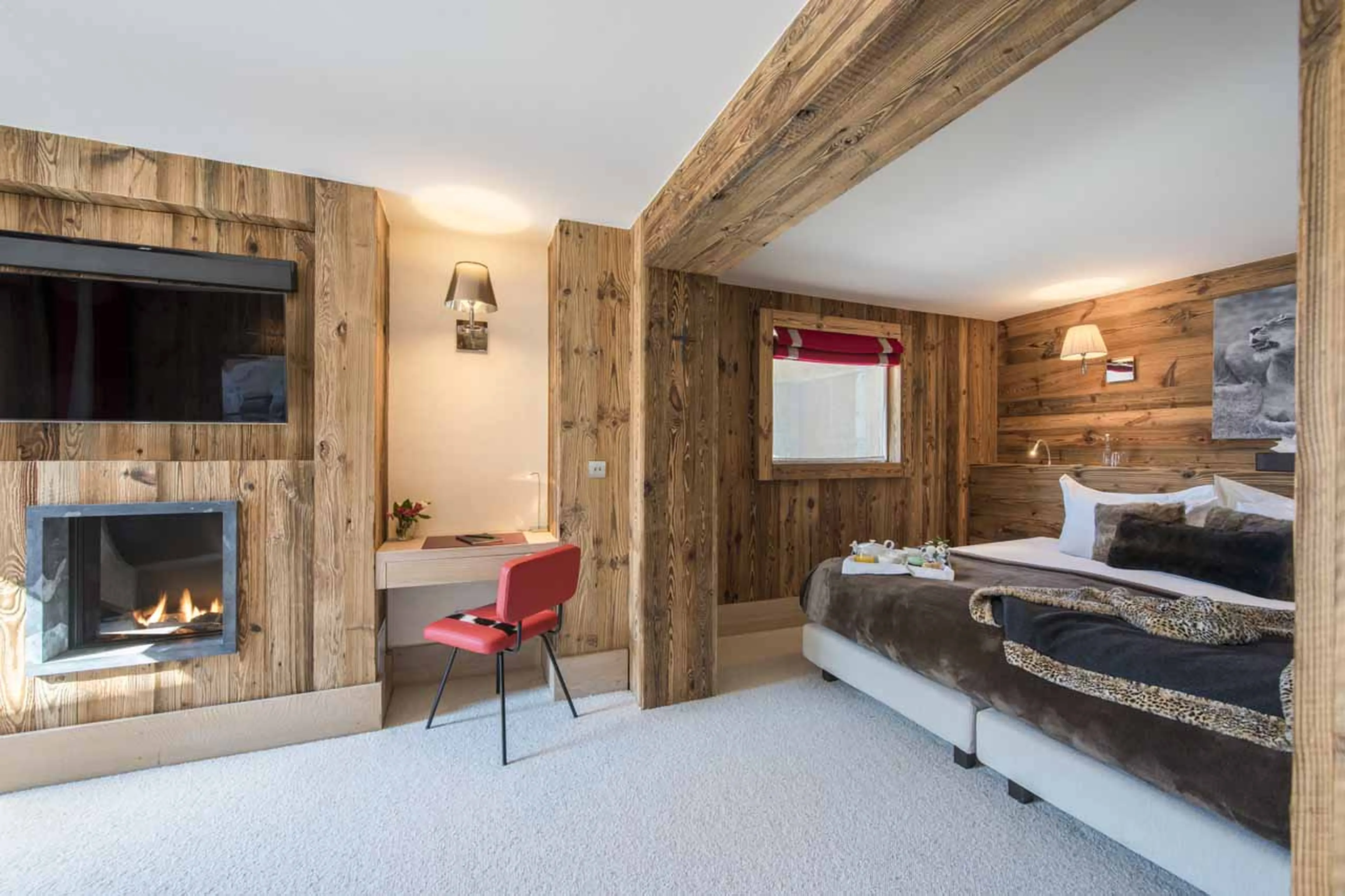 Fireplace in bedroom six at Chalet Mont Tremblant in Meribel