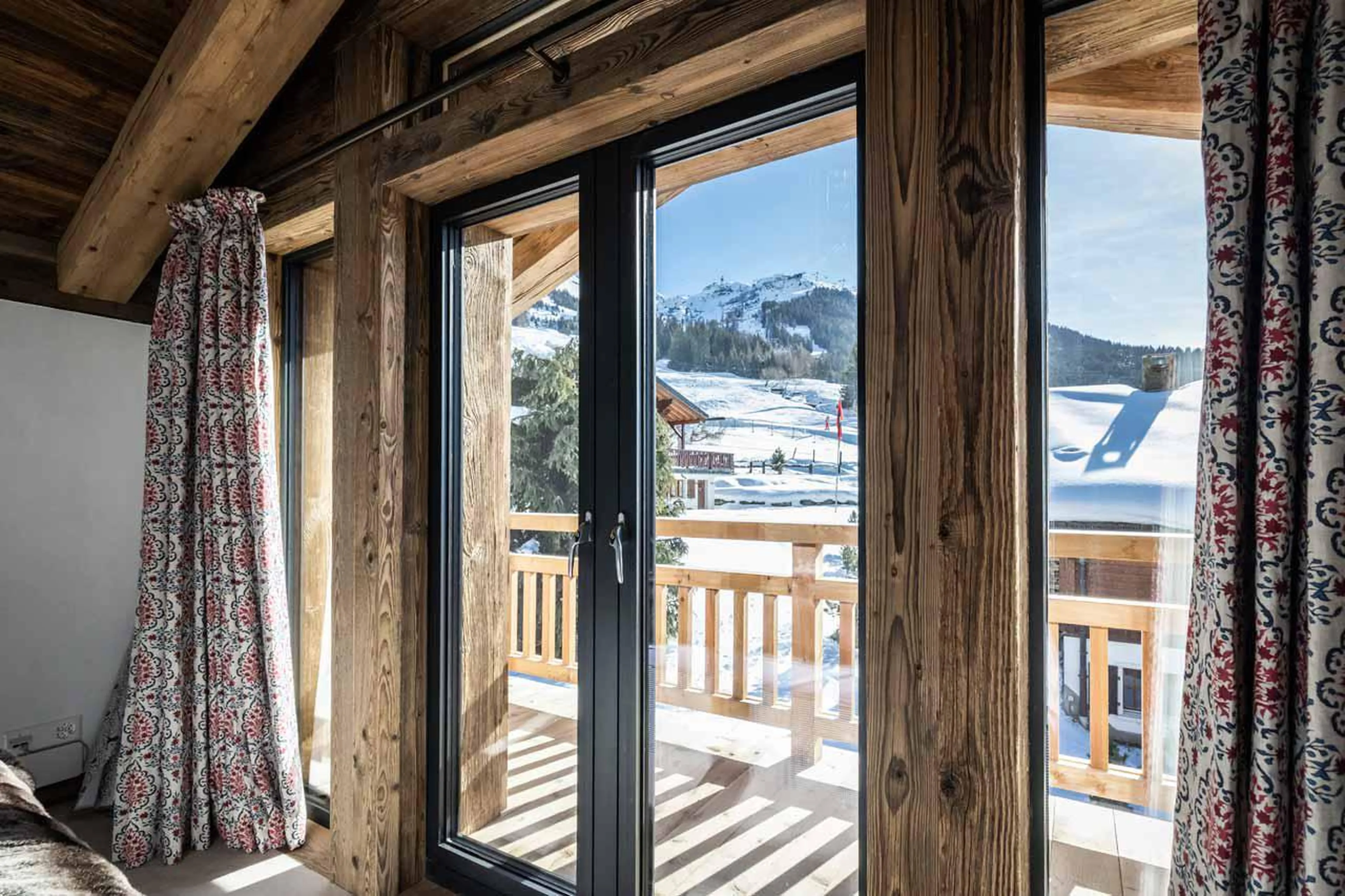 Balcony with panoramic mountain views at Chalet Munro in Verbier