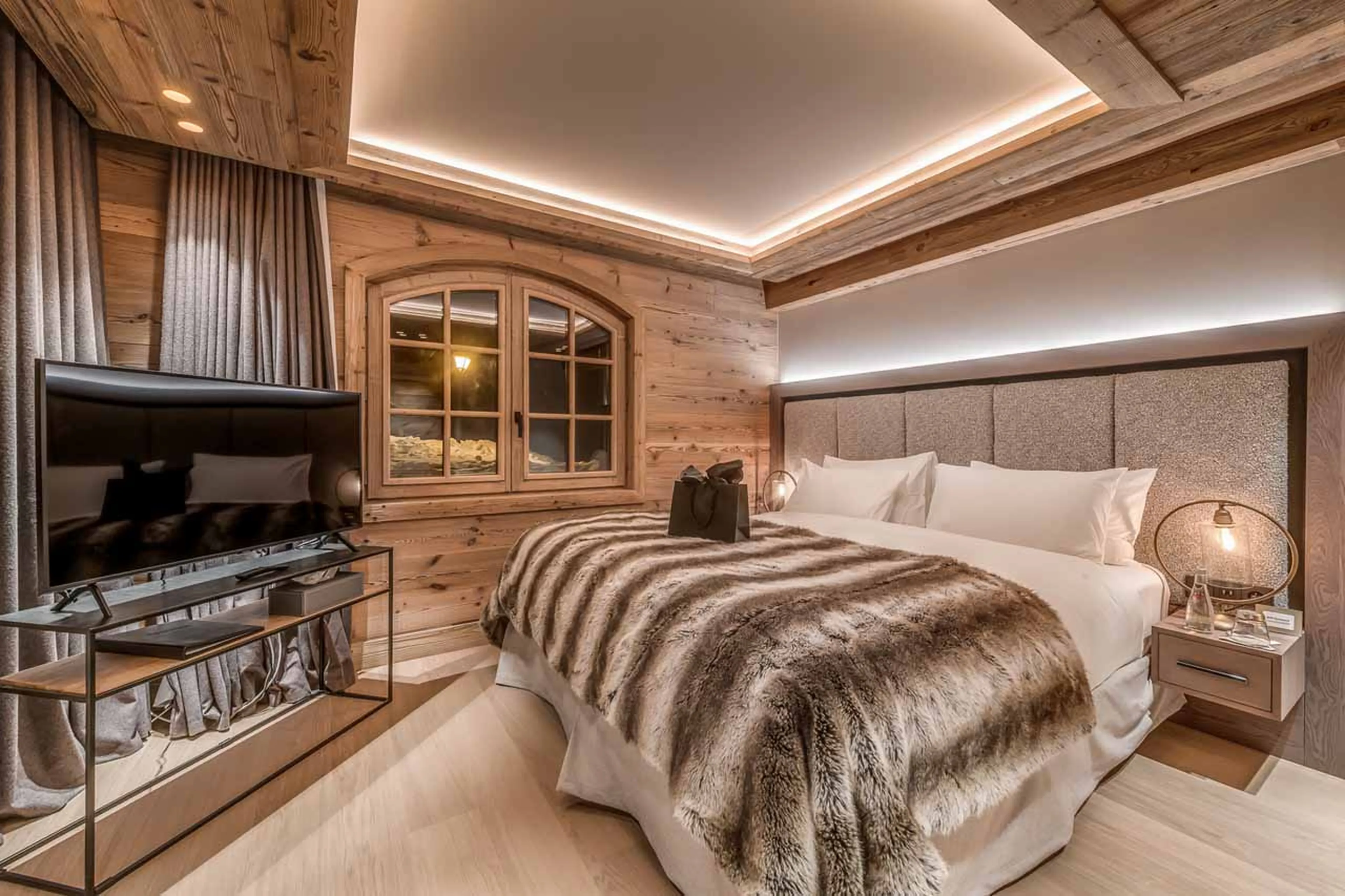 TV in bedroom one at  Chalet Le Namaste in Courchevel 1850