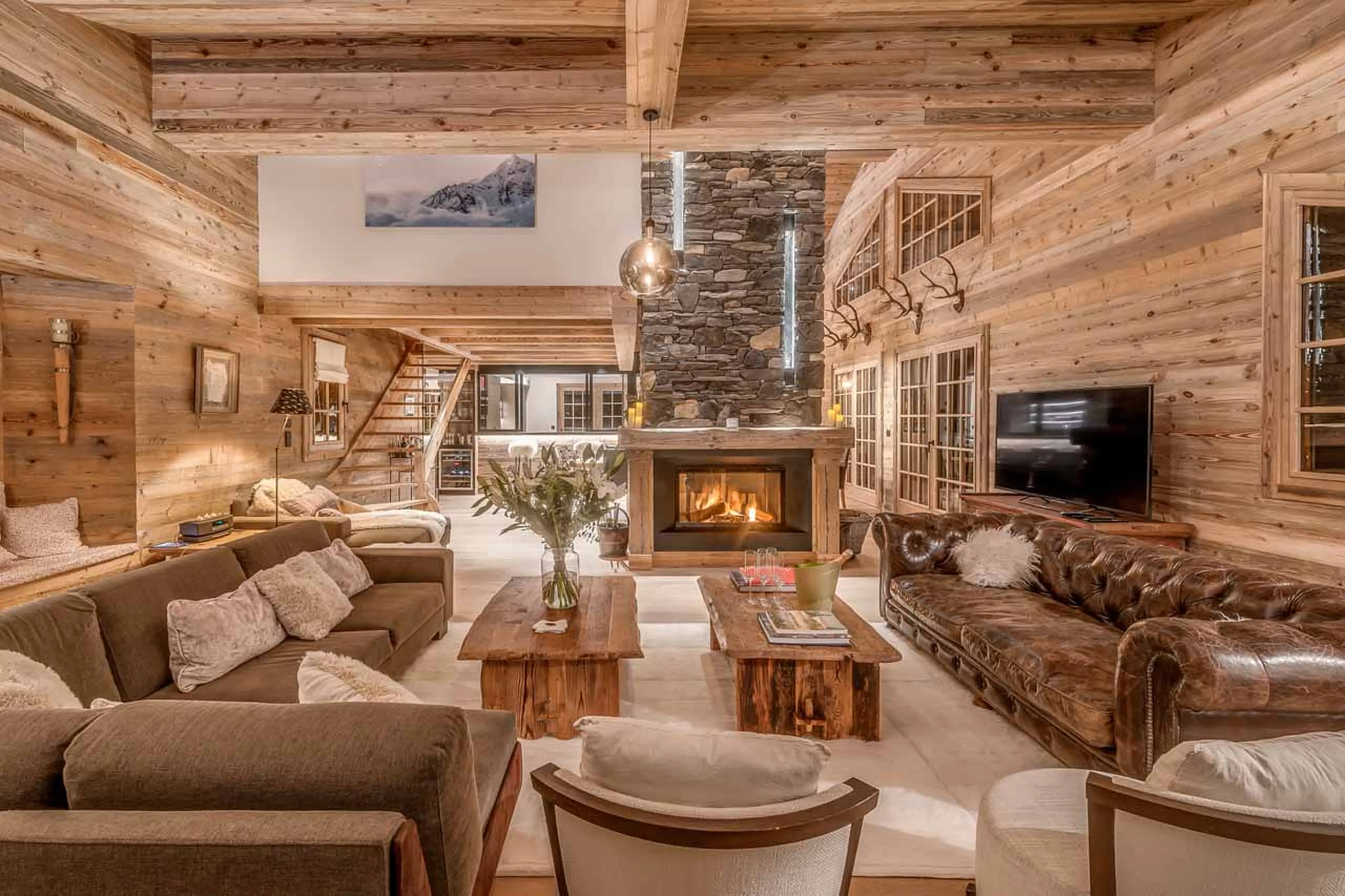 Fireplace and TV in living area of  Chalet Le Namaste in Courchevel 1850