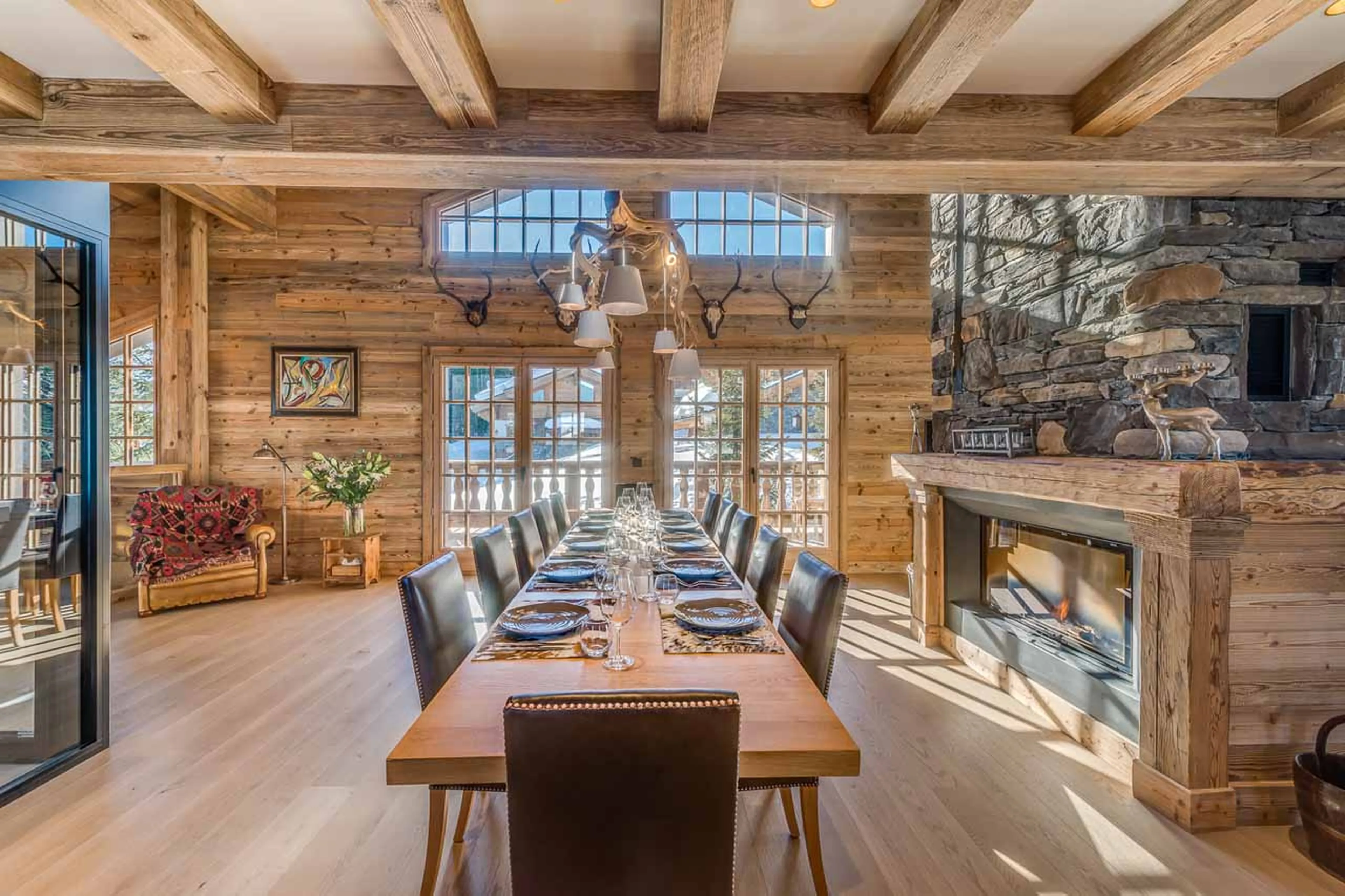 Dining area opening onto terrace at  Chalet Le Namaste in Courchevel 1850