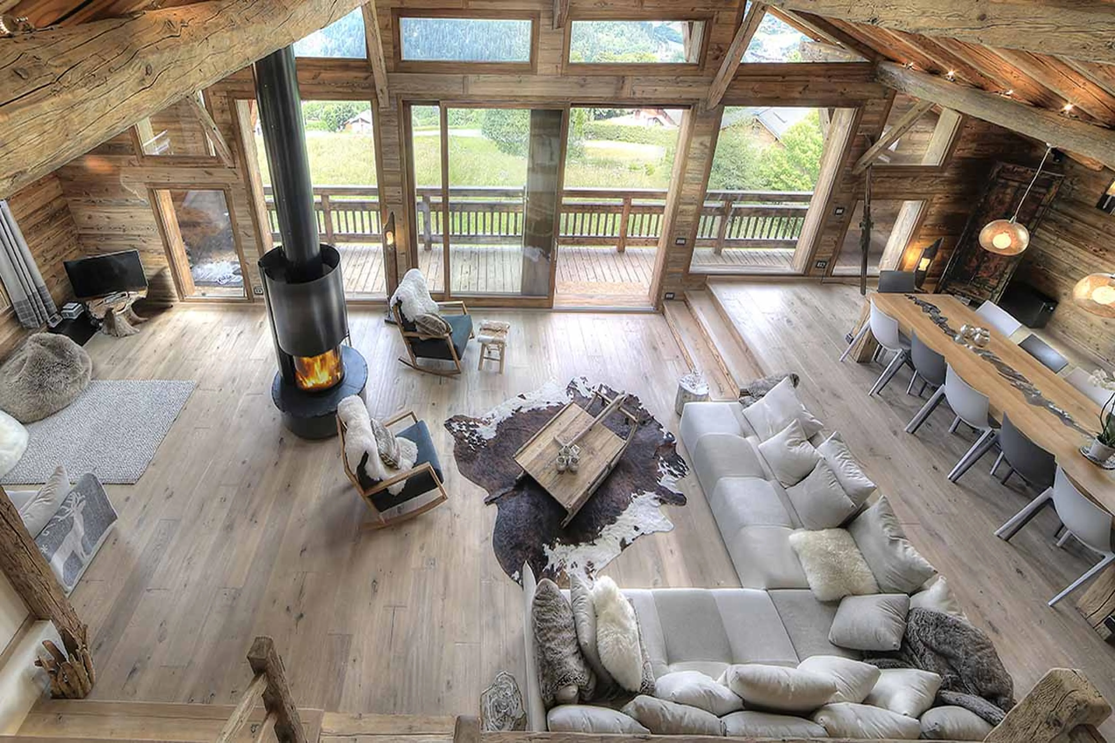 Living area around a central fireplace in Chalet Norel in Chamonix