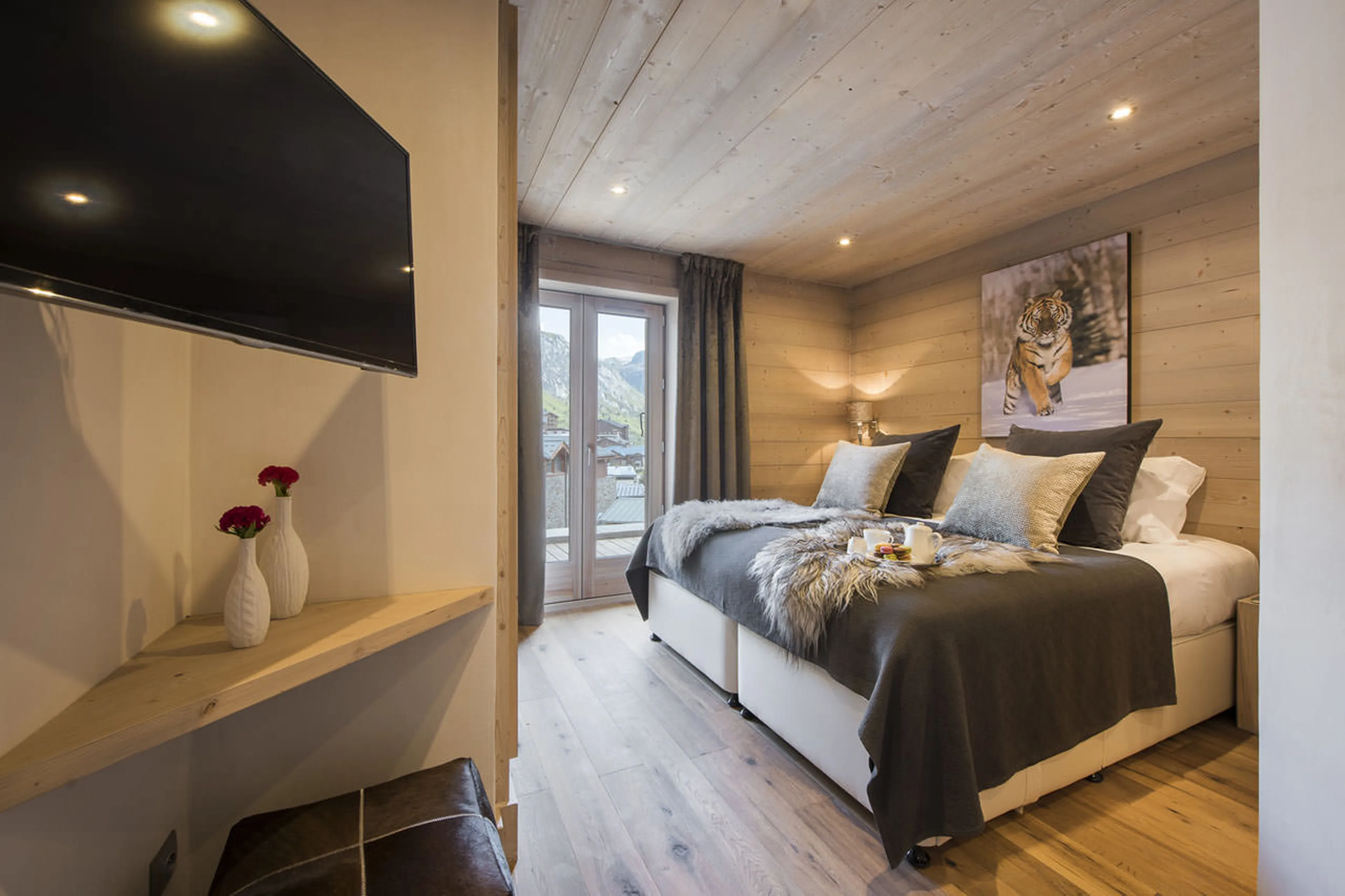 TV in bedroom five at Chalet Opale in Tignes