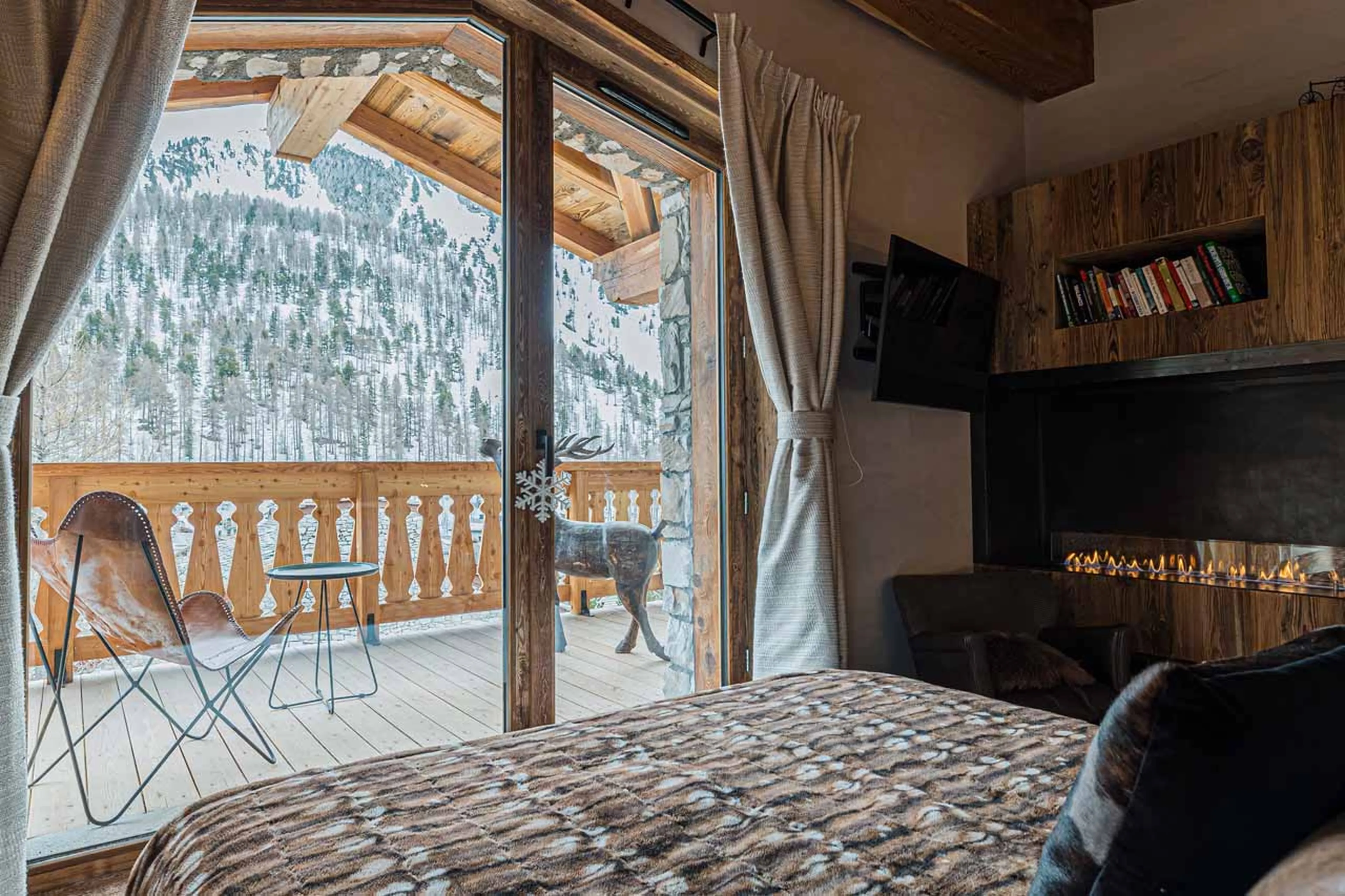 Fireplace in bedroom 2 at Chalet Orca in Val d'Isere