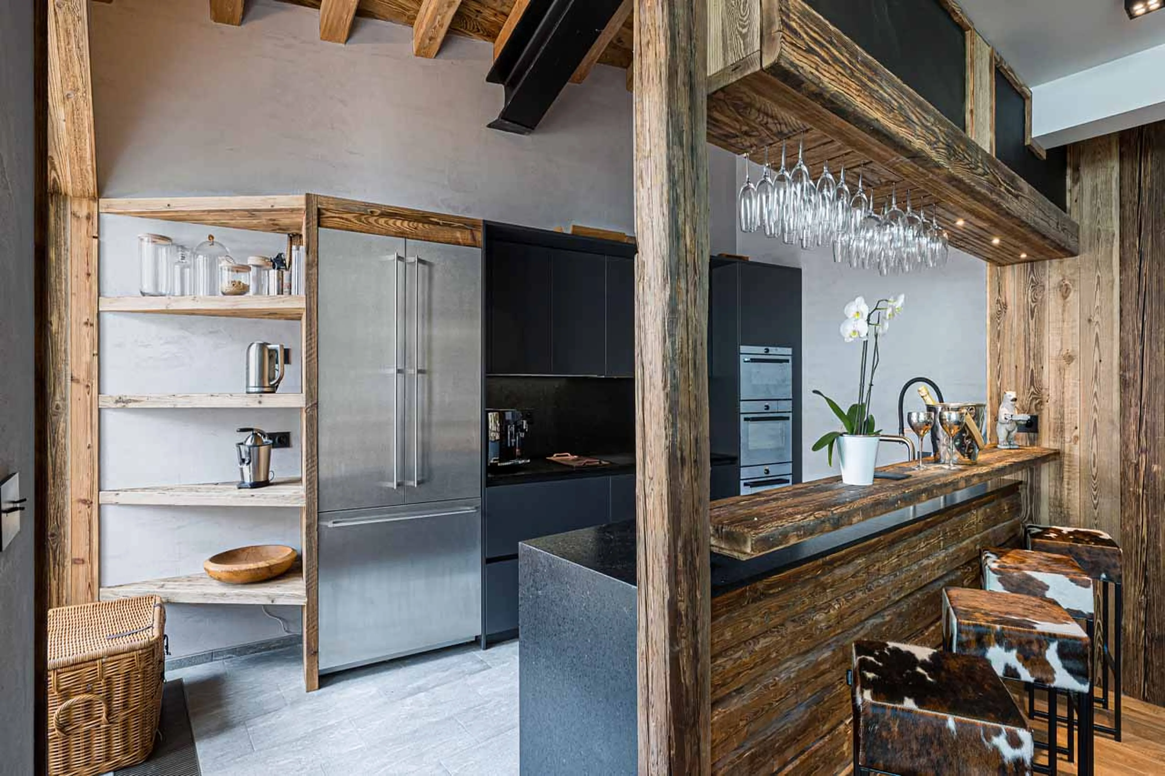 Kitchen with bar at  Chalet Les Ours in Val d'Isere