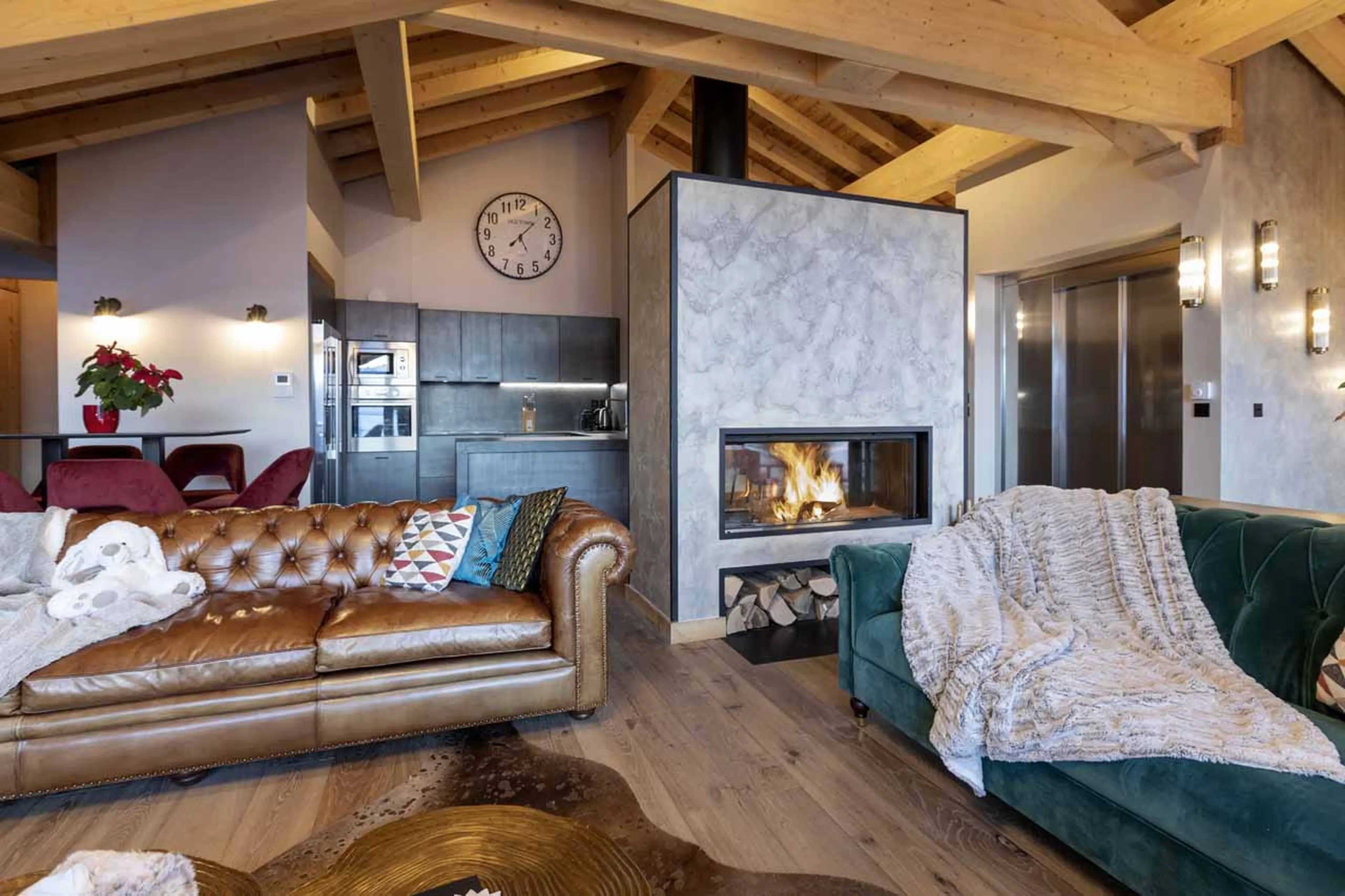 Fireplace in living area of Chalet Orlov in Val Thorens