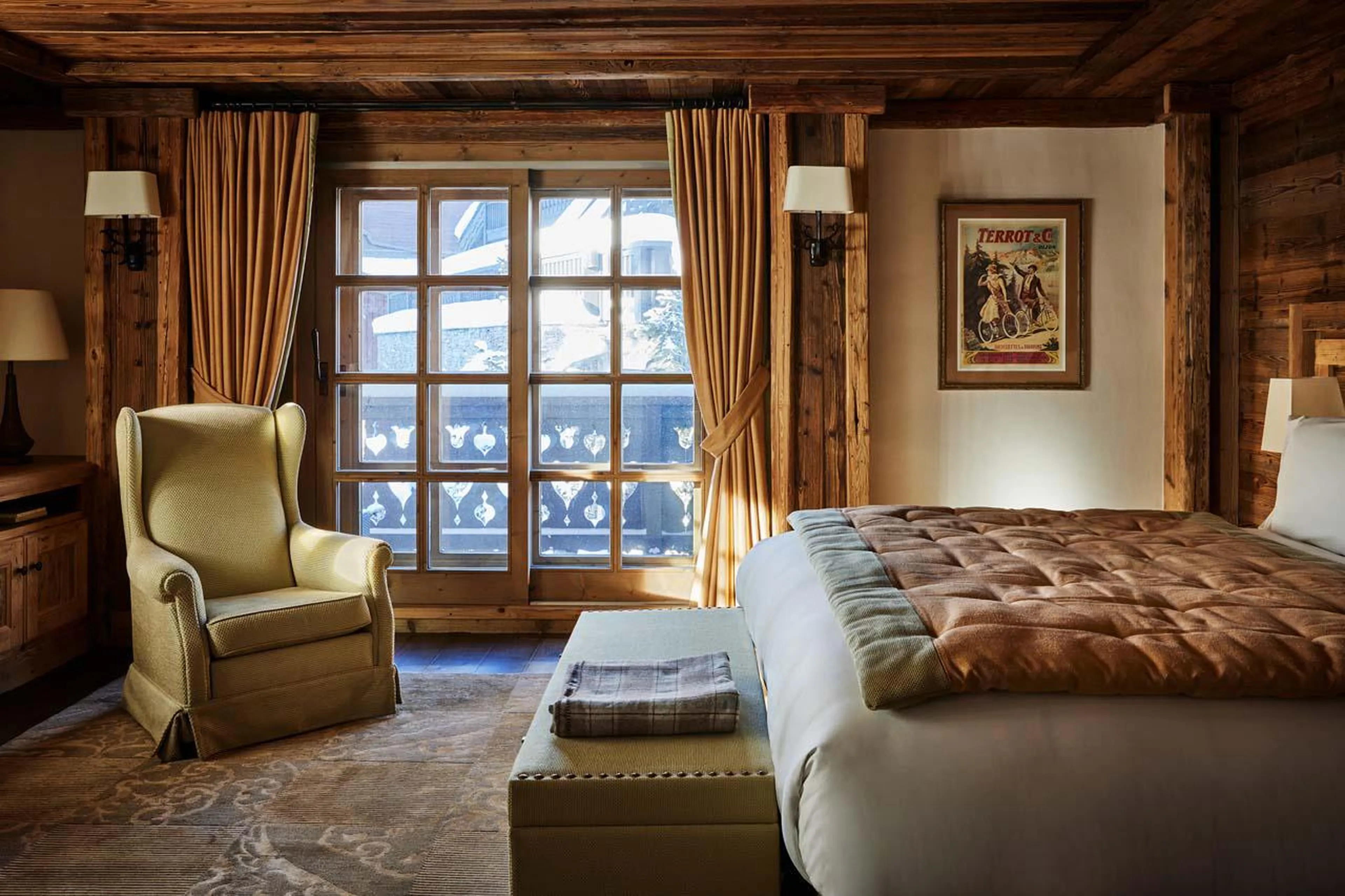 Spacious bedroom with access to private balcony at Chalet Ormello in Courchevel 1850