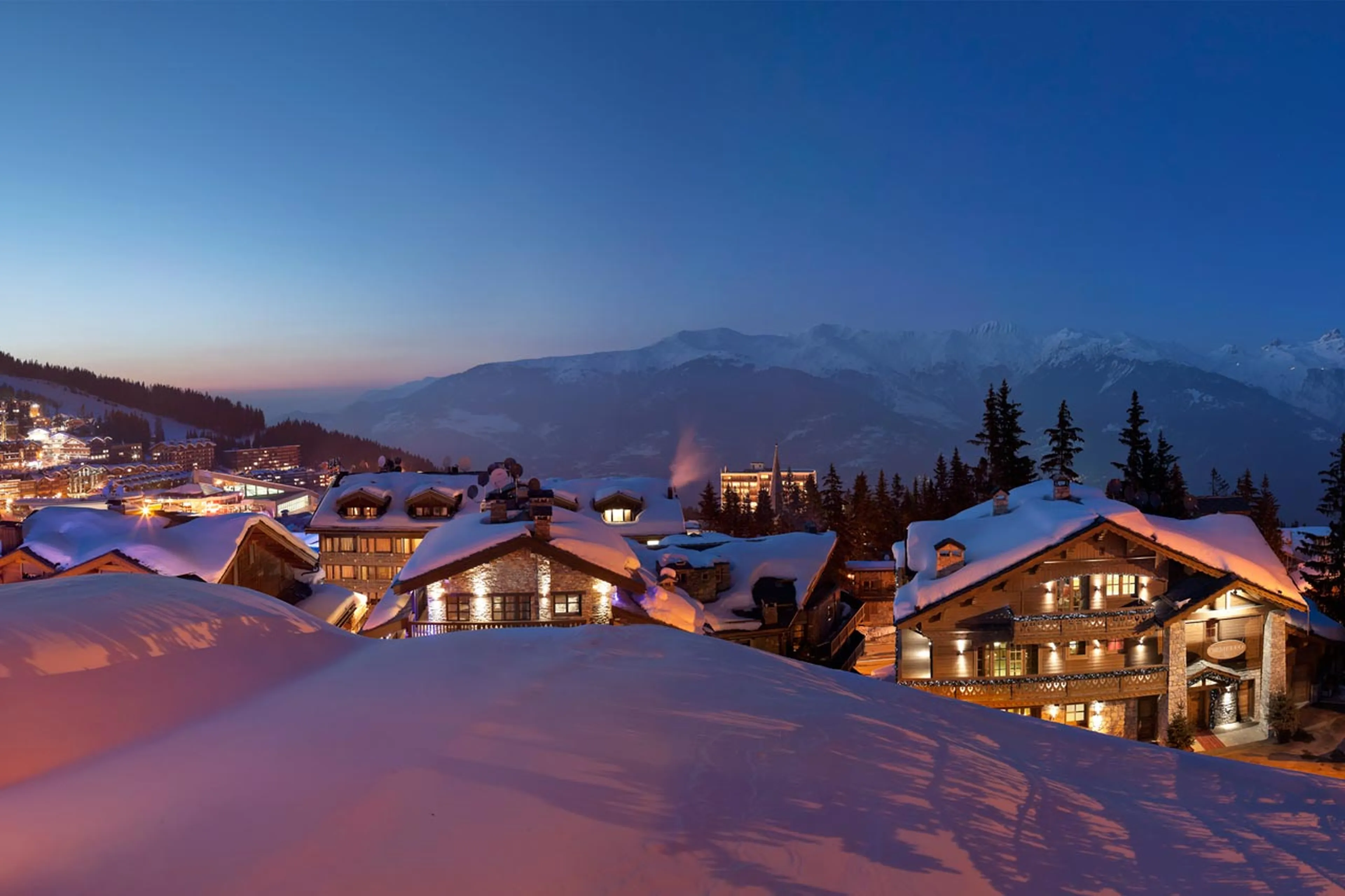 Chalet Ormello in Courchevel 1850 basks in early morning pink light