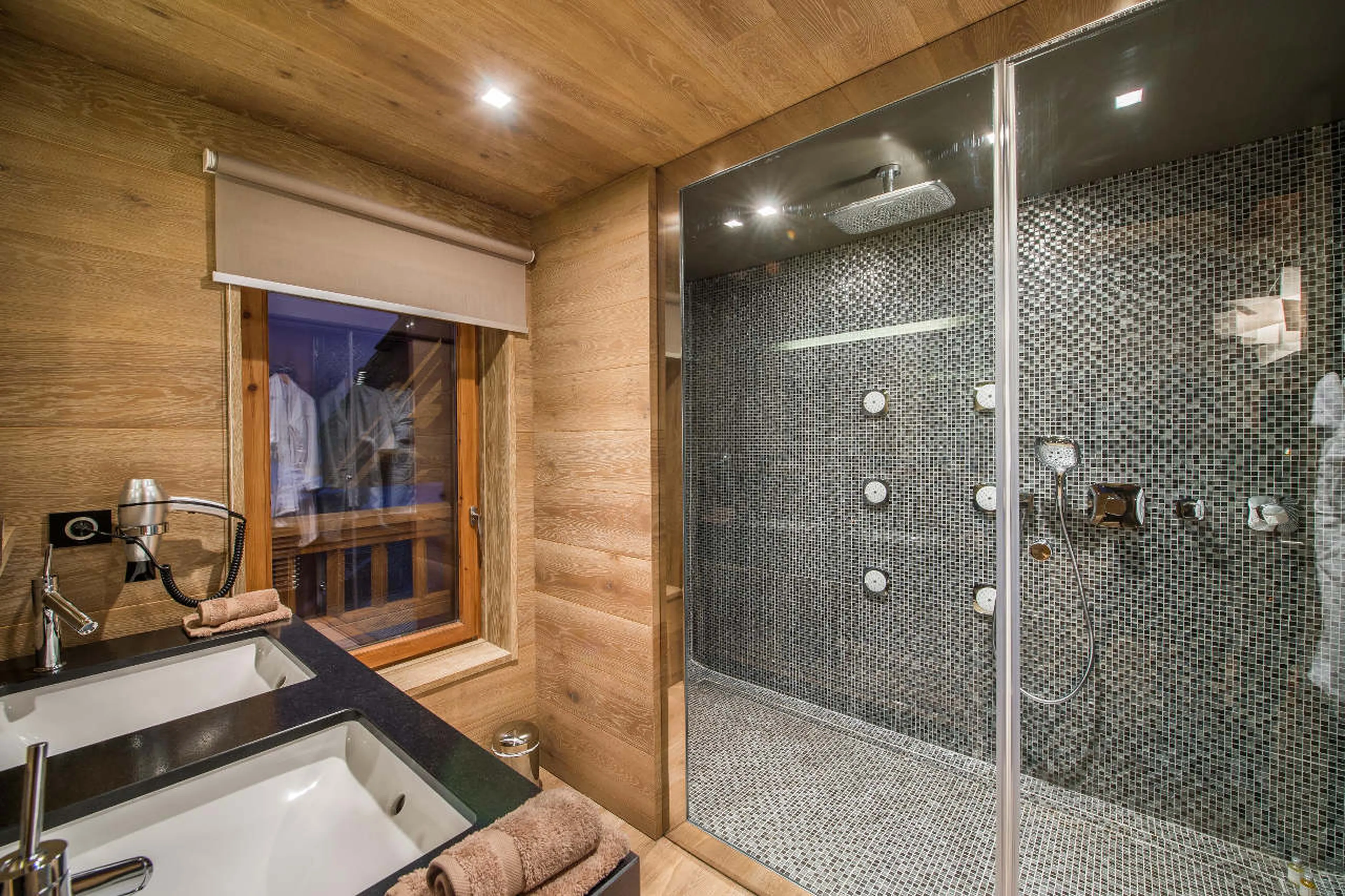 En-suite shower room with double basin and separate WC in Chalet Overview in Courchevel 1650