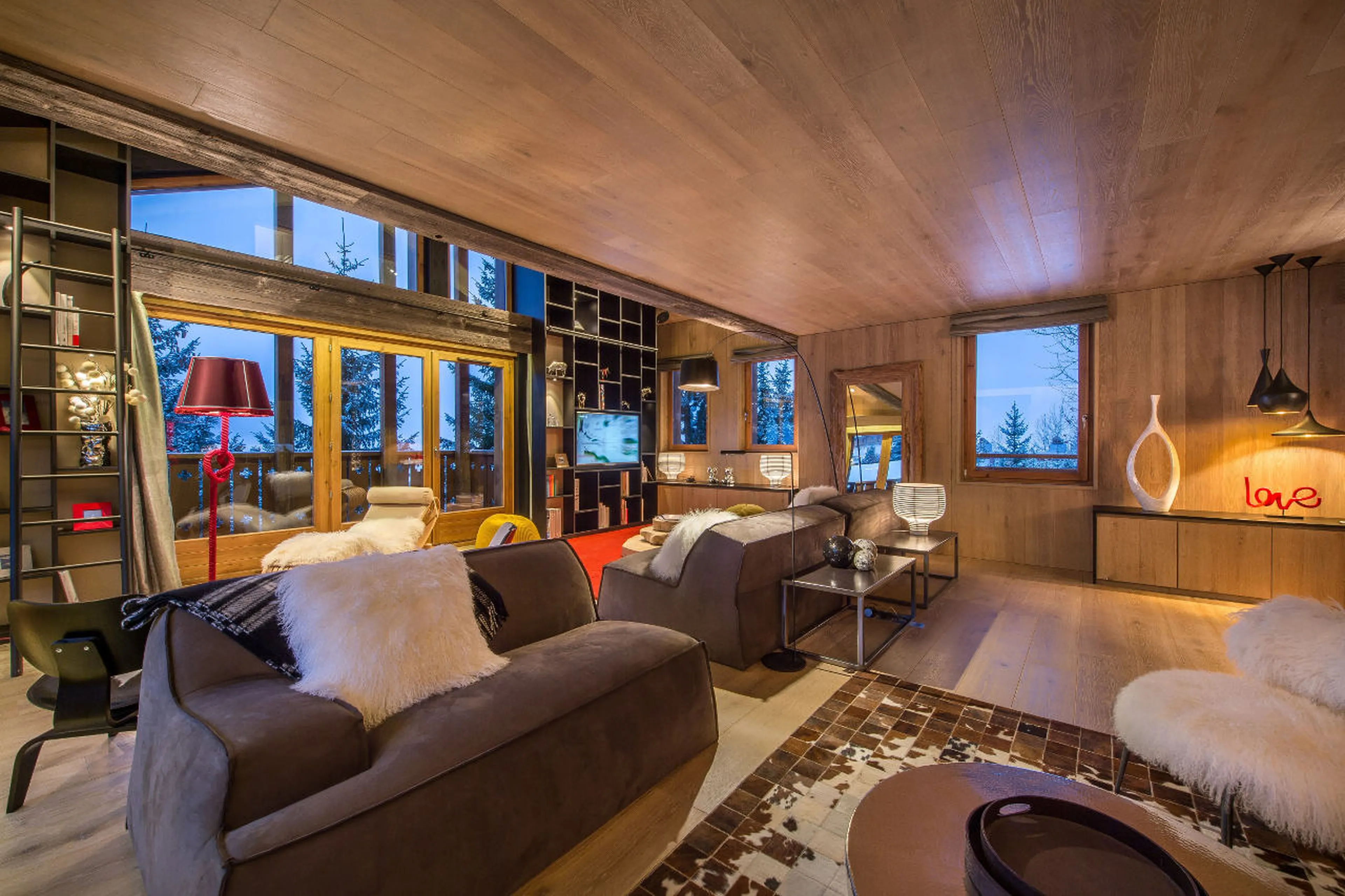 Living room with access to south facing balcony in Chalet Overview in Courchevel 1650