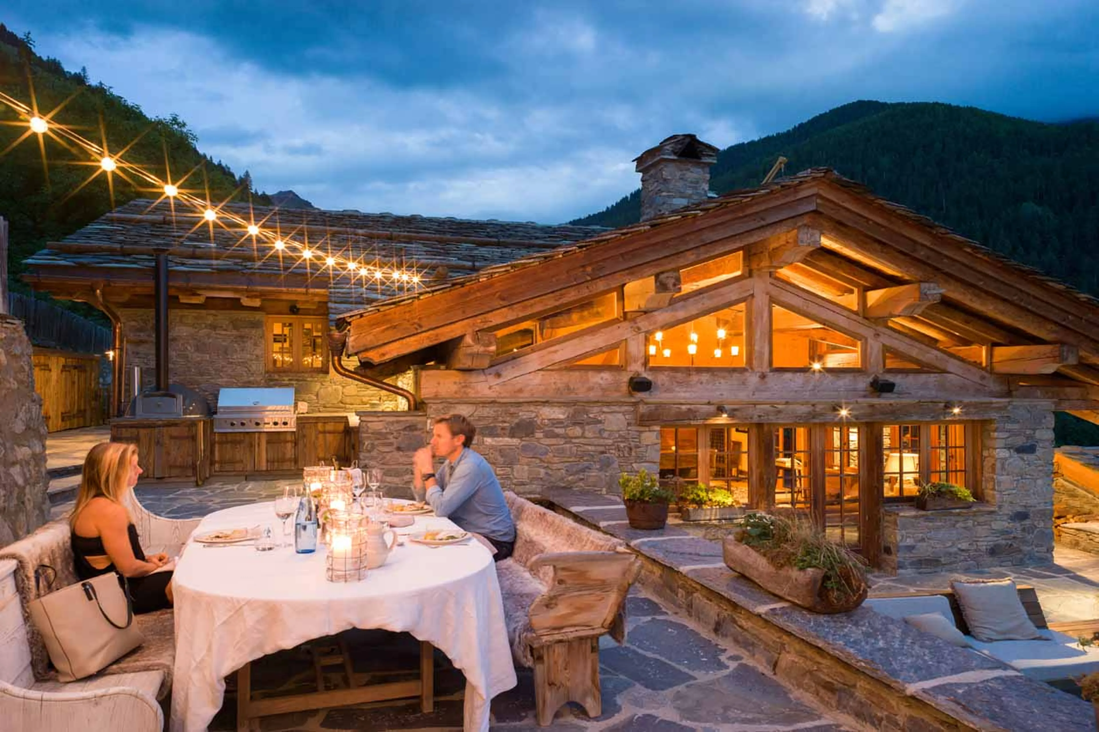 Dining on the terrace at Chalet Pelerin in Le Miroir