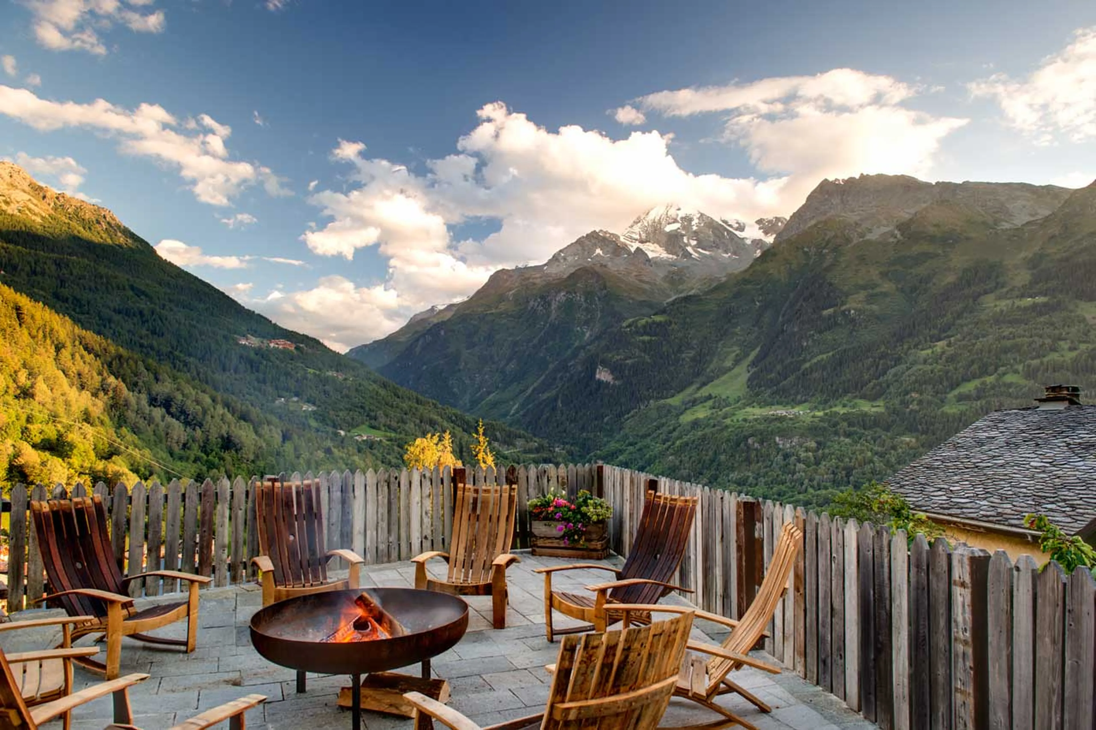 Terrace with fire pit at Chalet Pelerin in Le Miroir