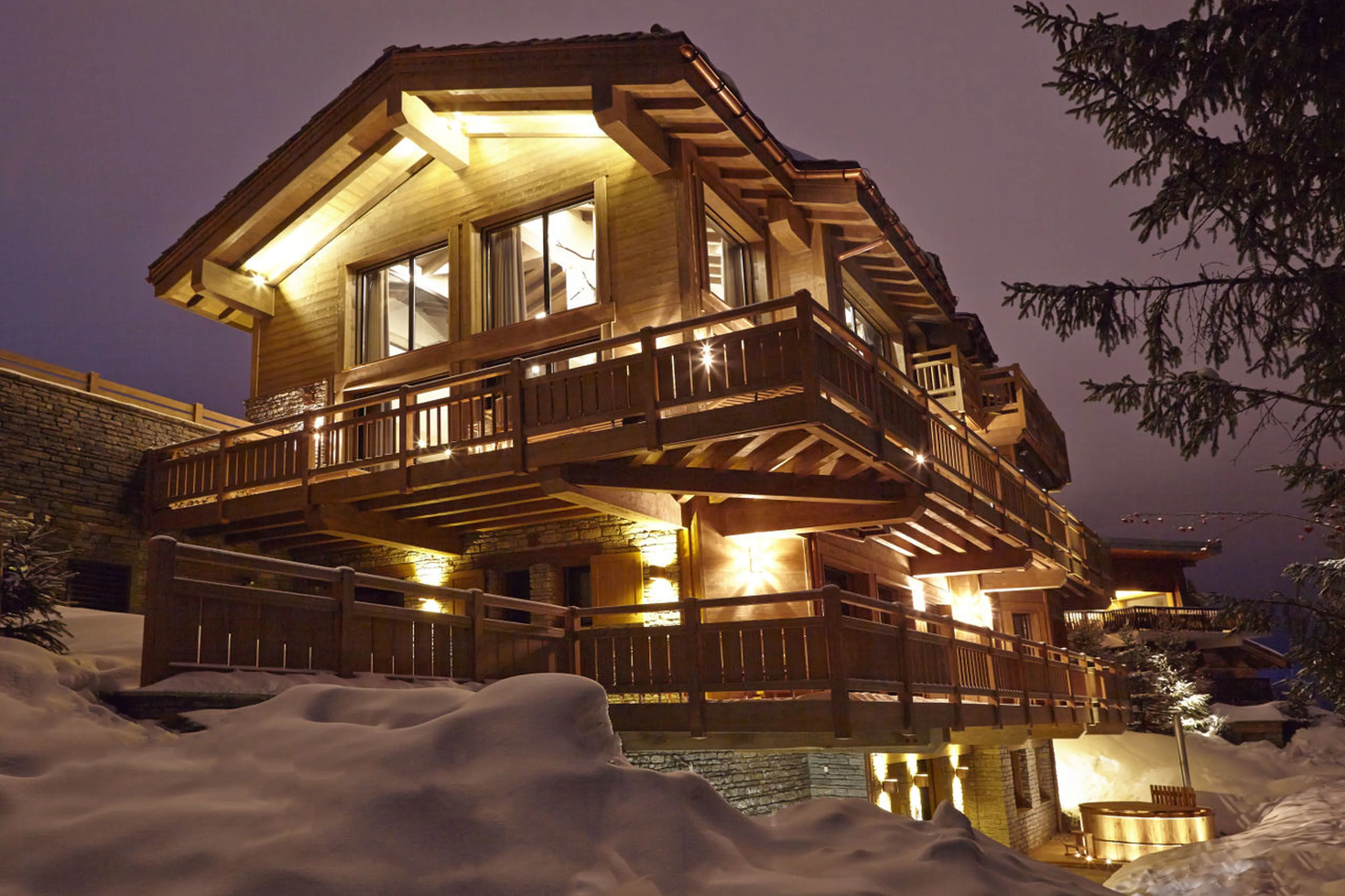 Night time exterior view of Chalet Perce Neige in Courchevel 1850