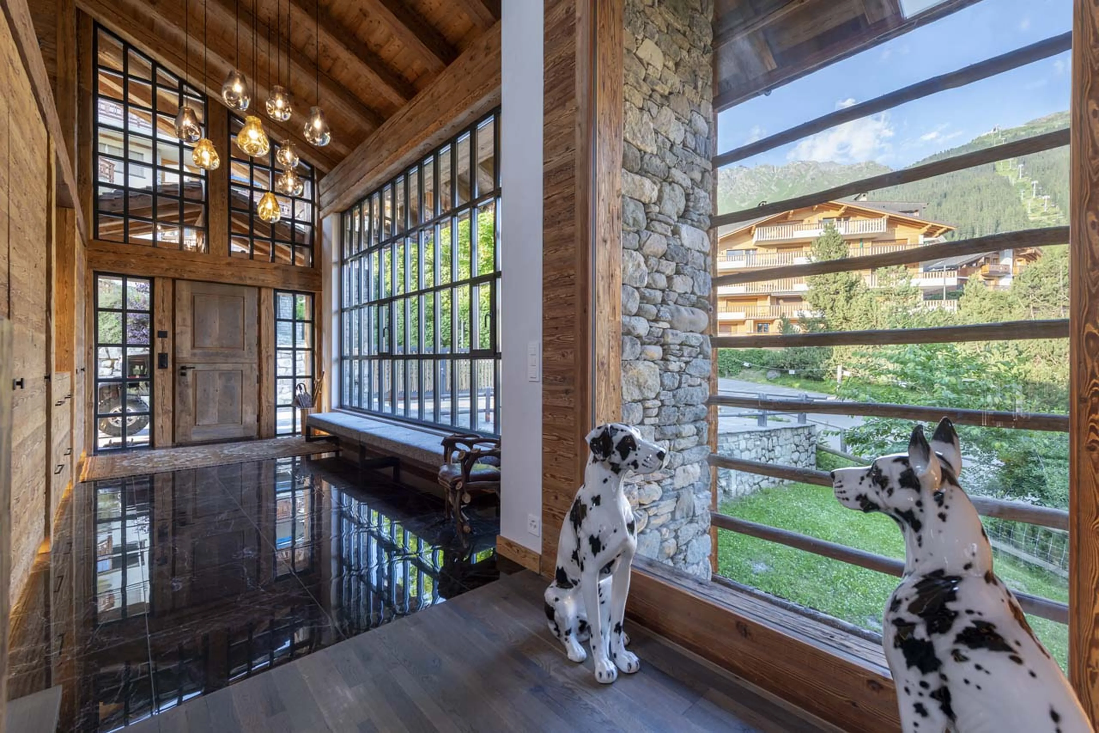 Dog sculptures in entrance hall at Chalet Peter Pan in Verbier