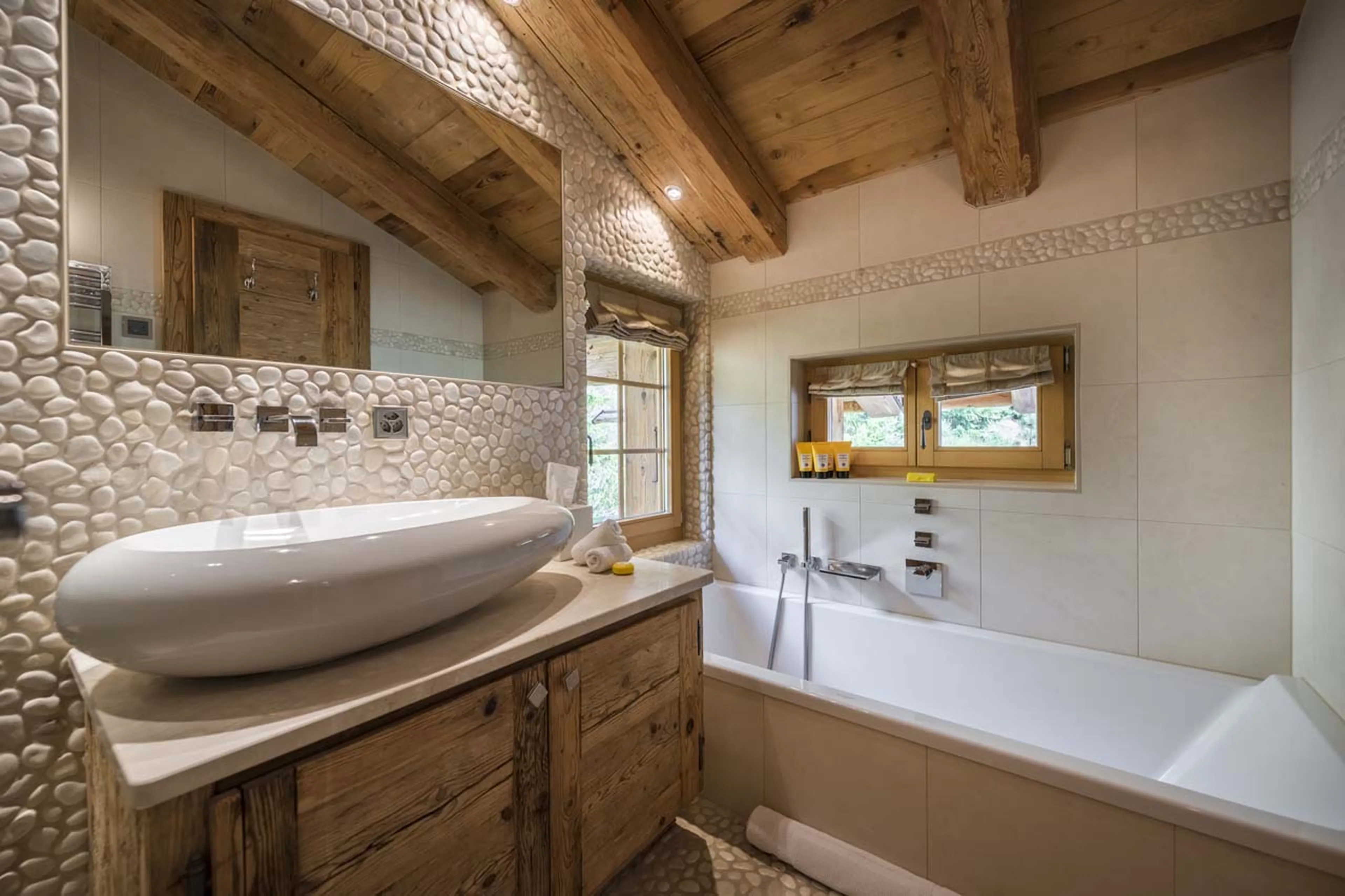 Bathroom one bathtub at Chalet Petit Ours in Verbier