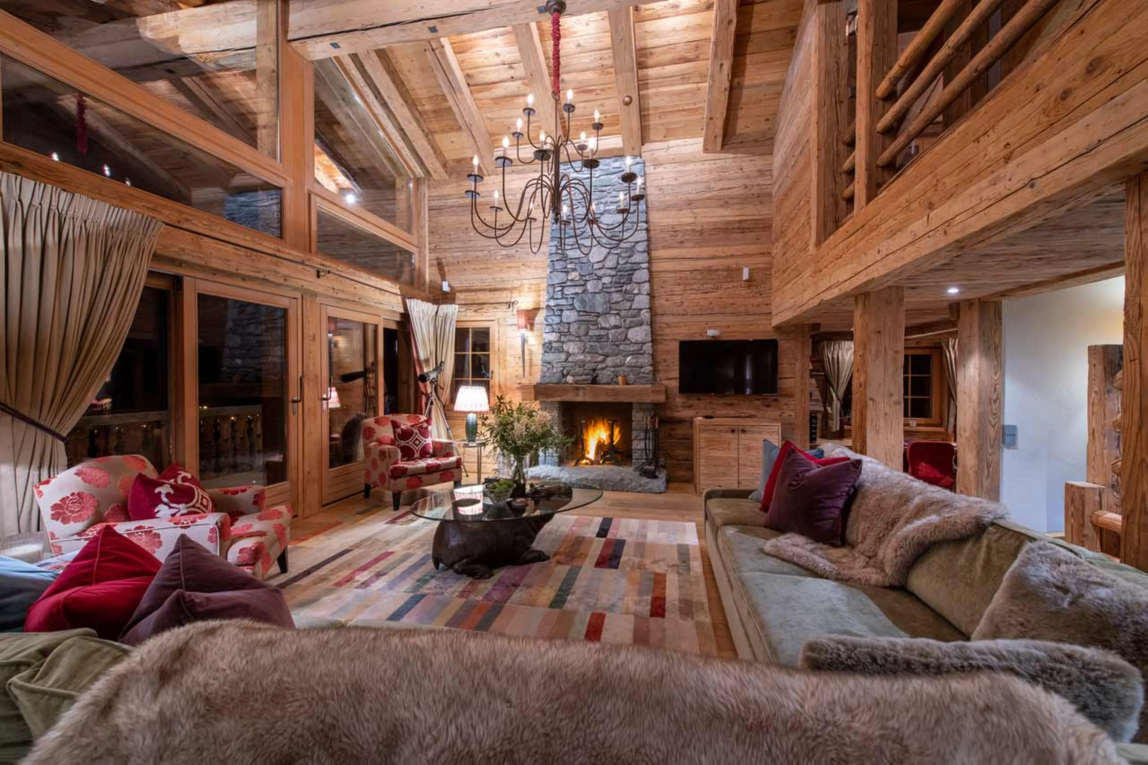 Living room at night at Chalet Petit Ours in Verbier