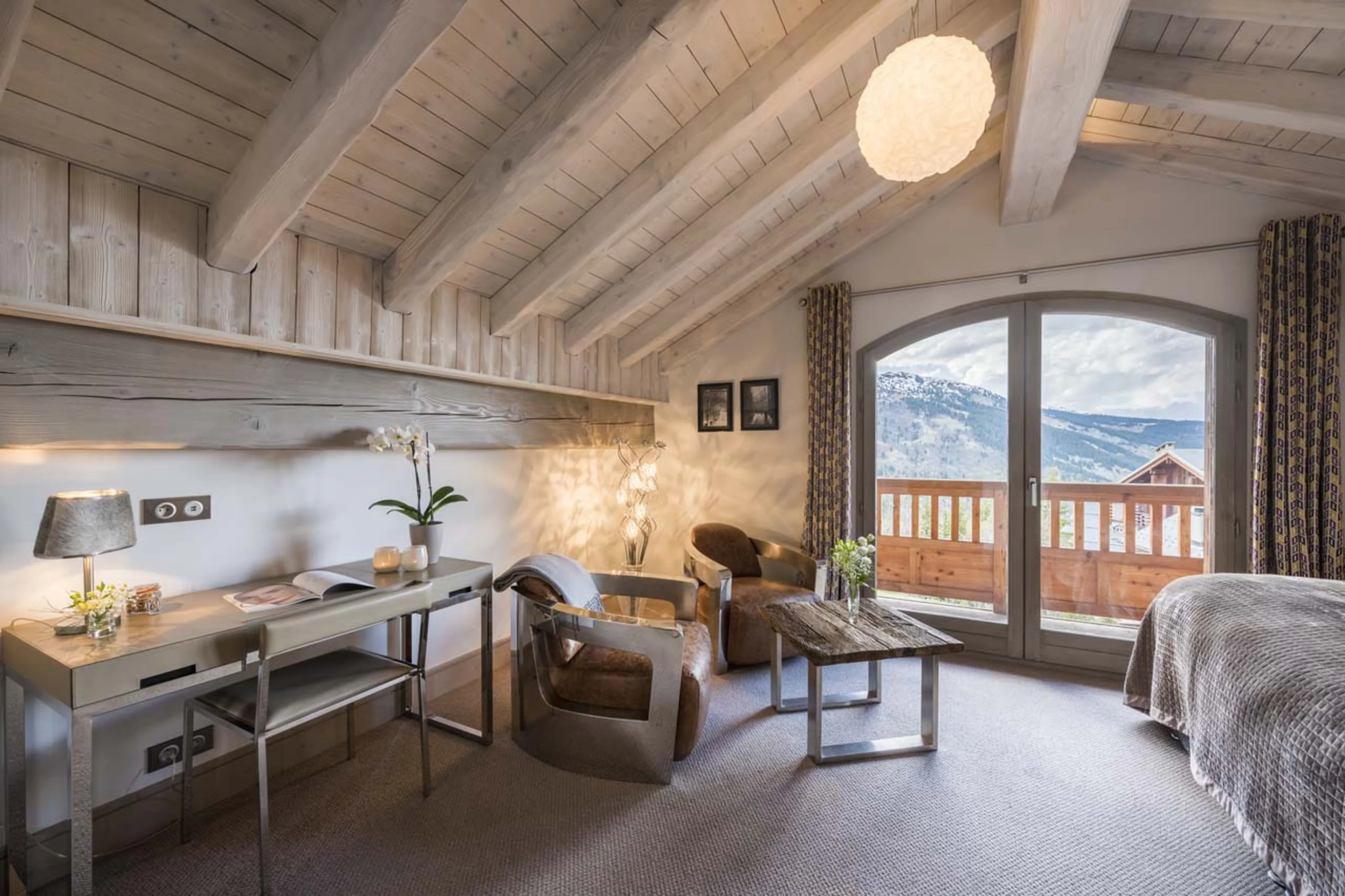 Access to balcony from bedroom one at  Chalet Pont du Cam in Meribel
