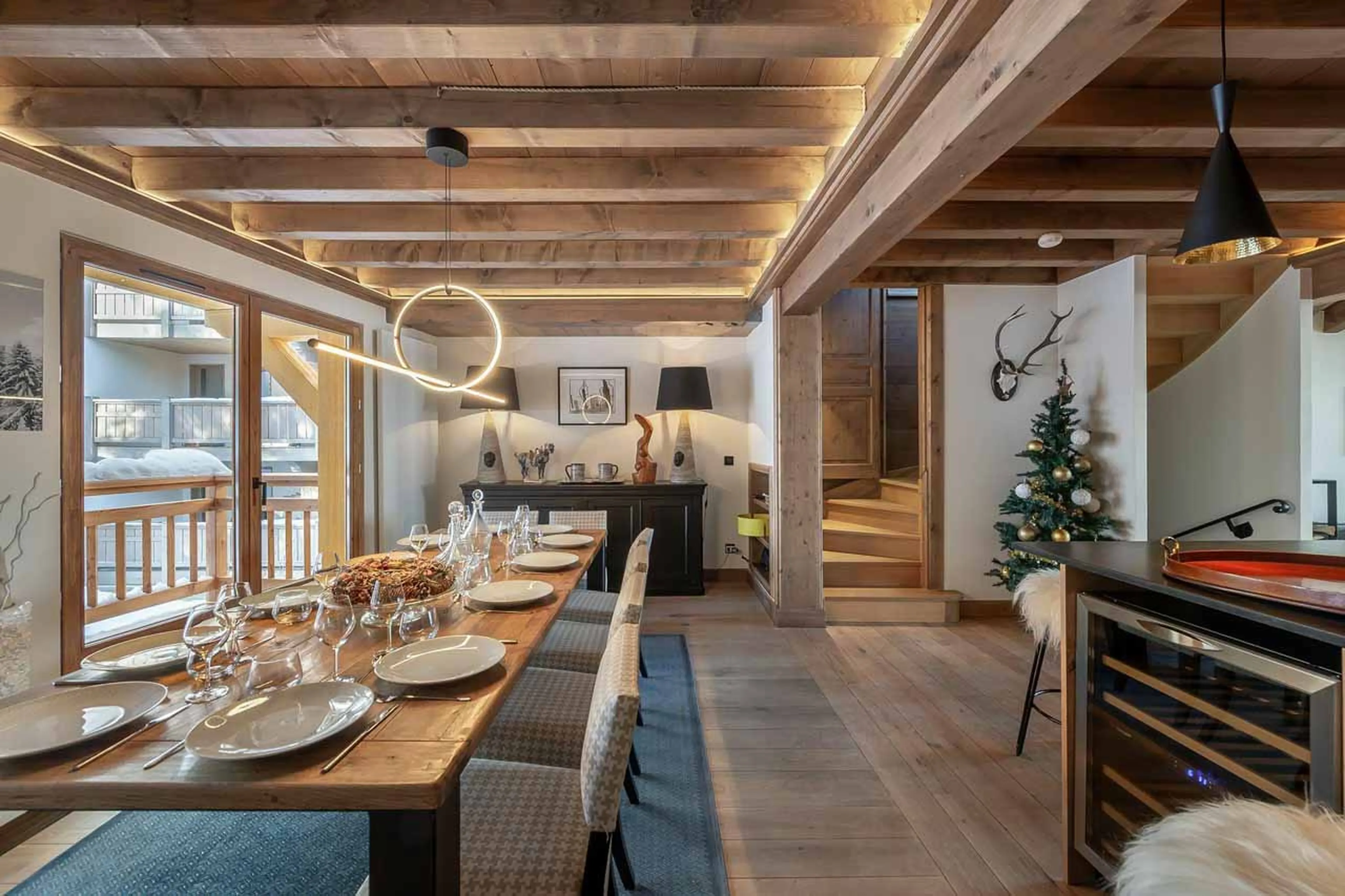 Dining area opening onto balcony at Chalet Prosper in Courchevel 1550