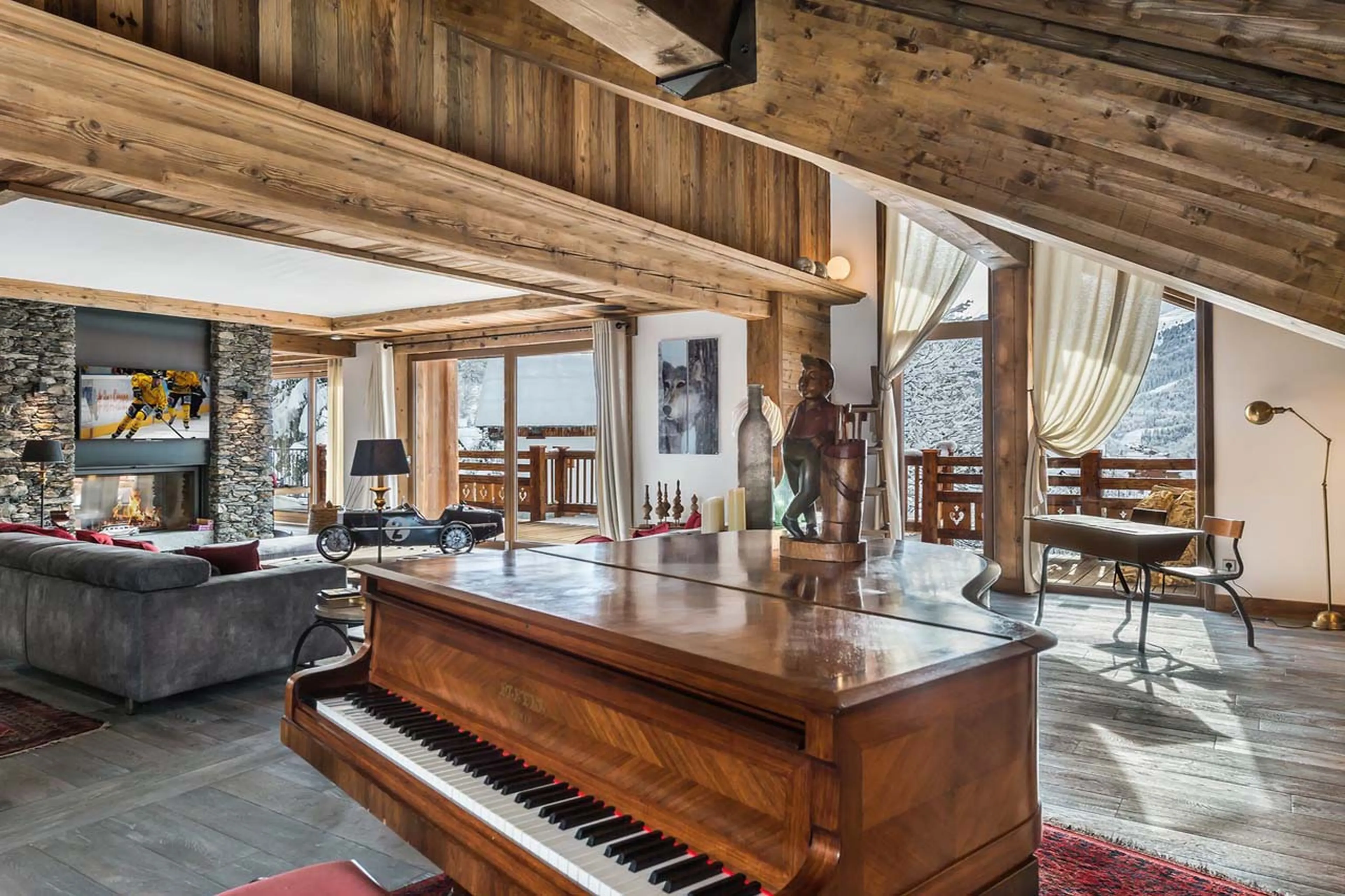 Grand piano in living area of Chalet Queen Mijane in Meribel