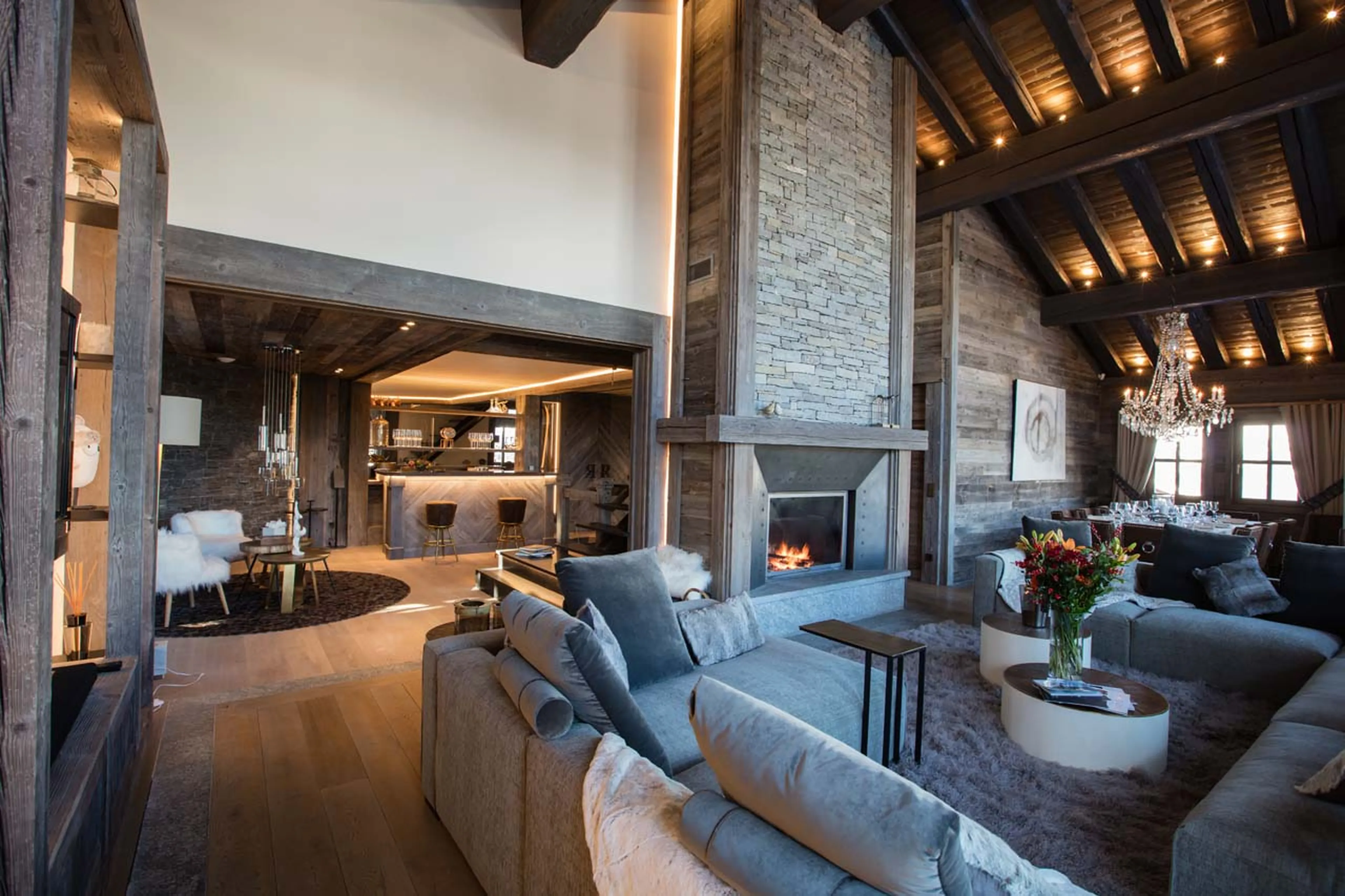 Open plan living and dining area with view of bar at Chalet Razzie in Courchevel 1850