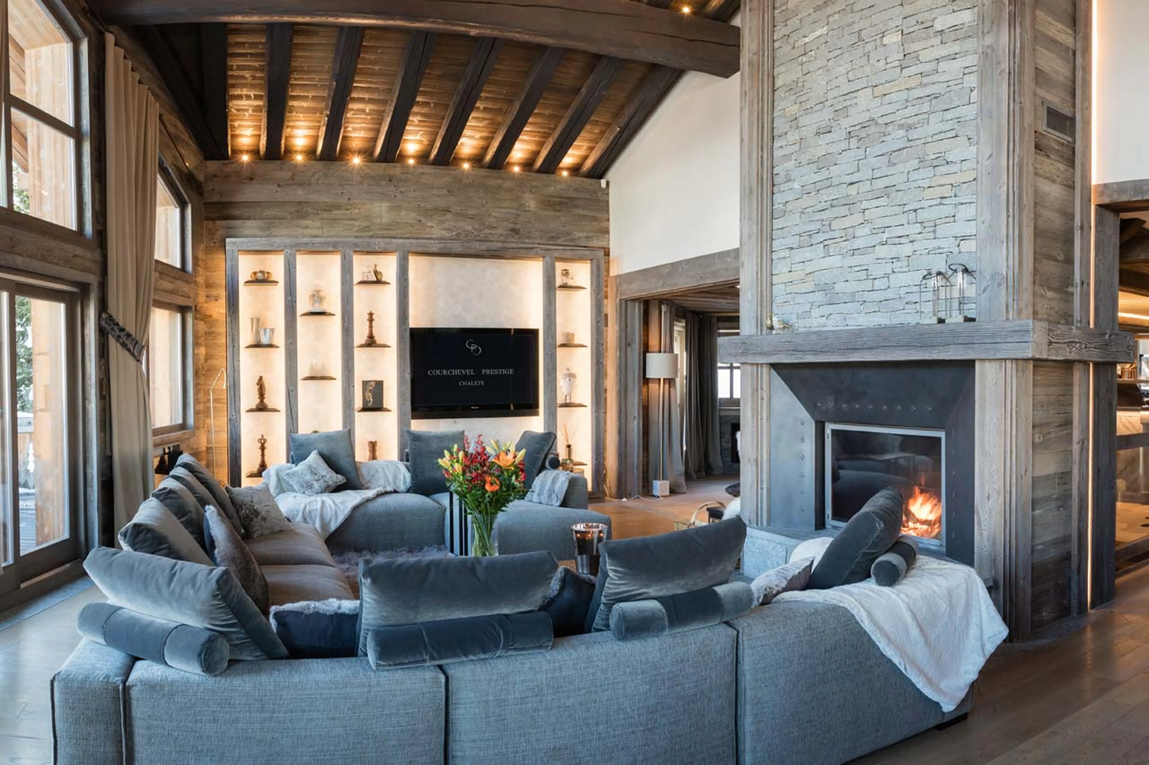 Fireplace and TV in living area of Chalet Razzie in Courchevel 1850