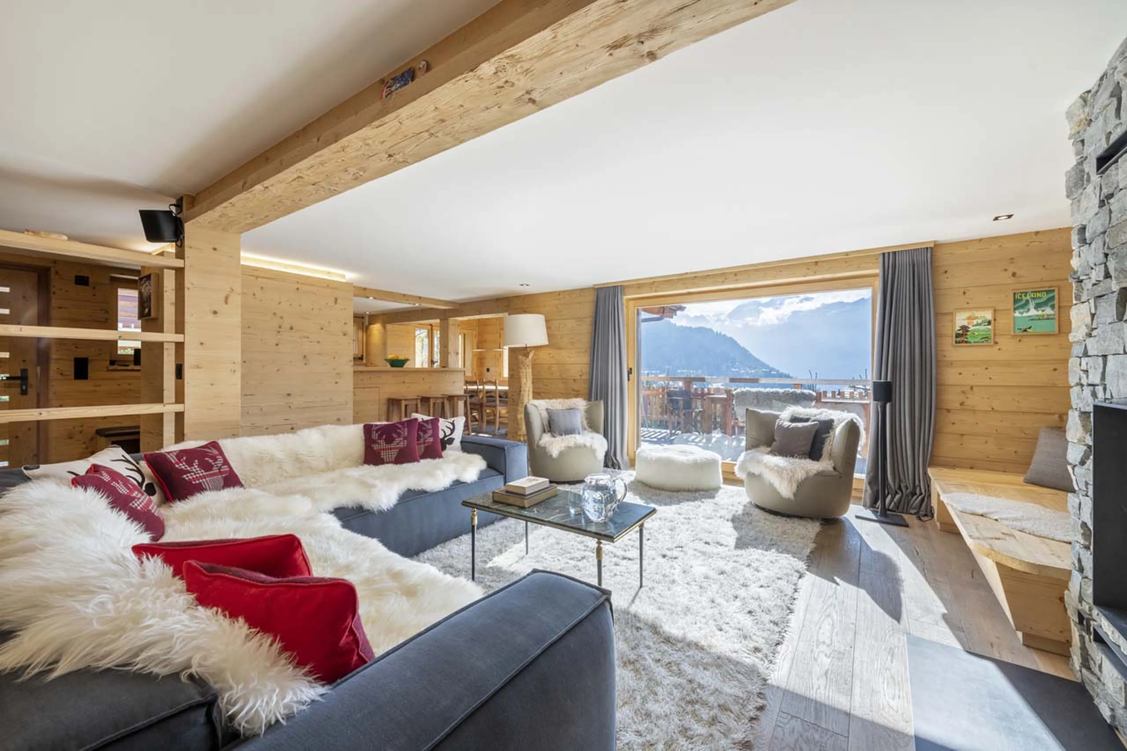The living room opens onto a balcony at Chalet Roselle in Verbier