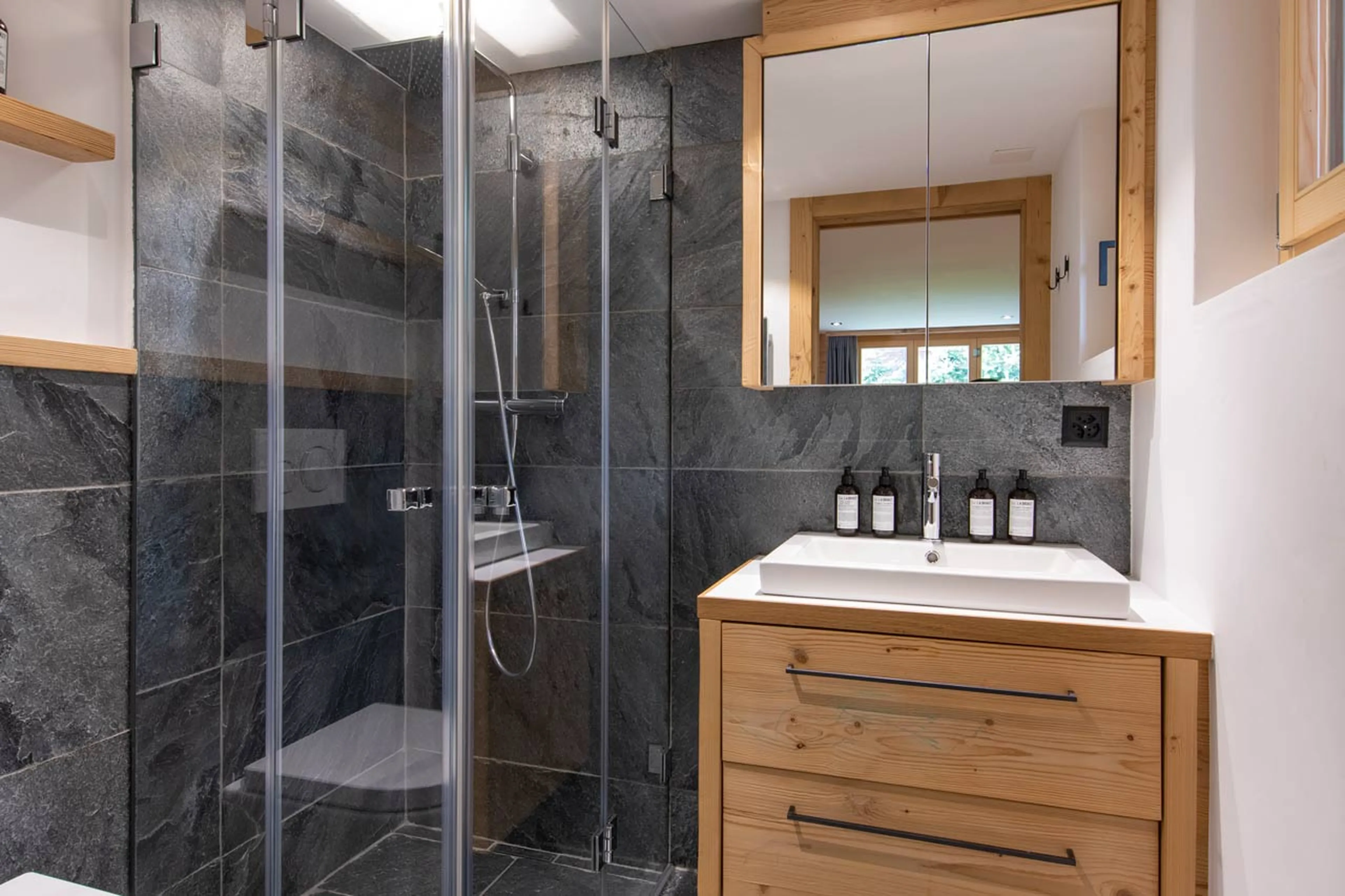 En-suite shower room to TV room  at Chalet Roselle in Verbier