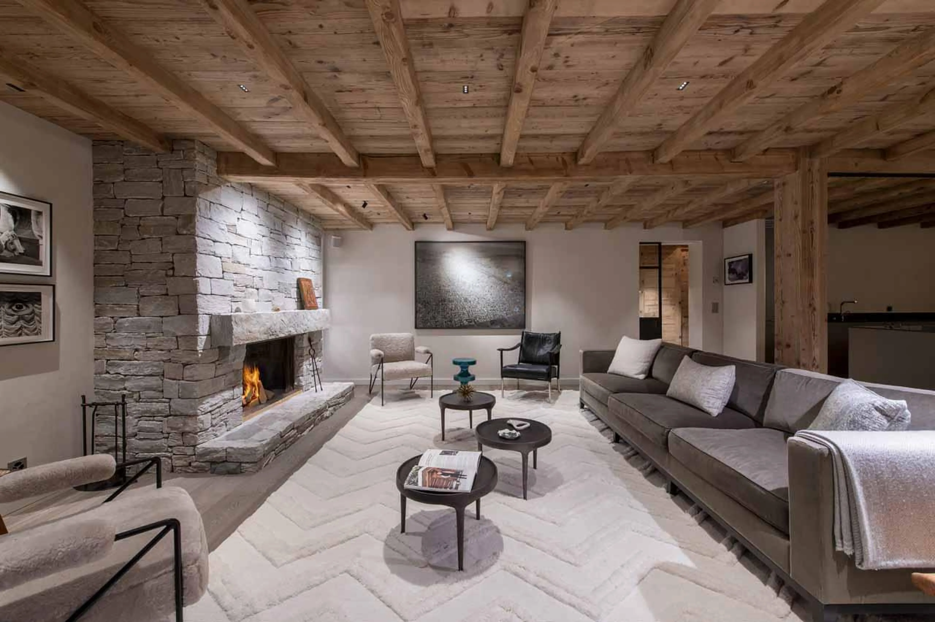 Open-plan living area with seating at Chalet Scandinavia, Verbier, Switzerland