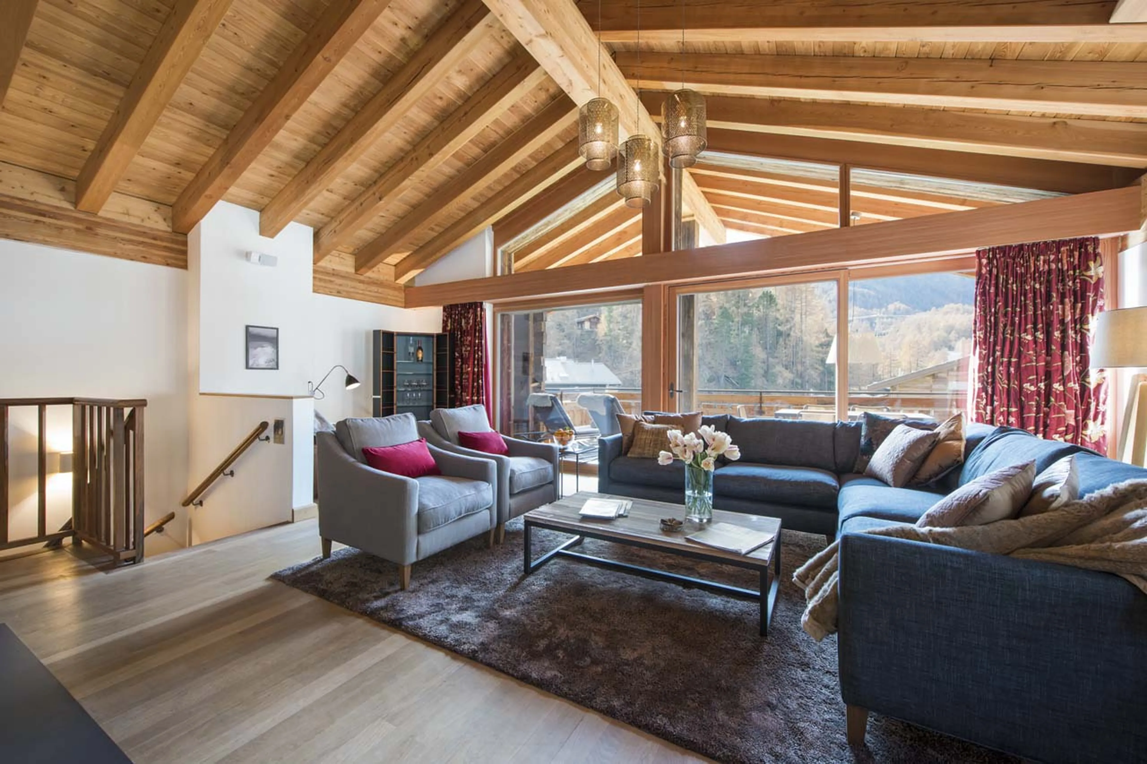 Living area with balcony at Chalet Shalimar in Zermatt