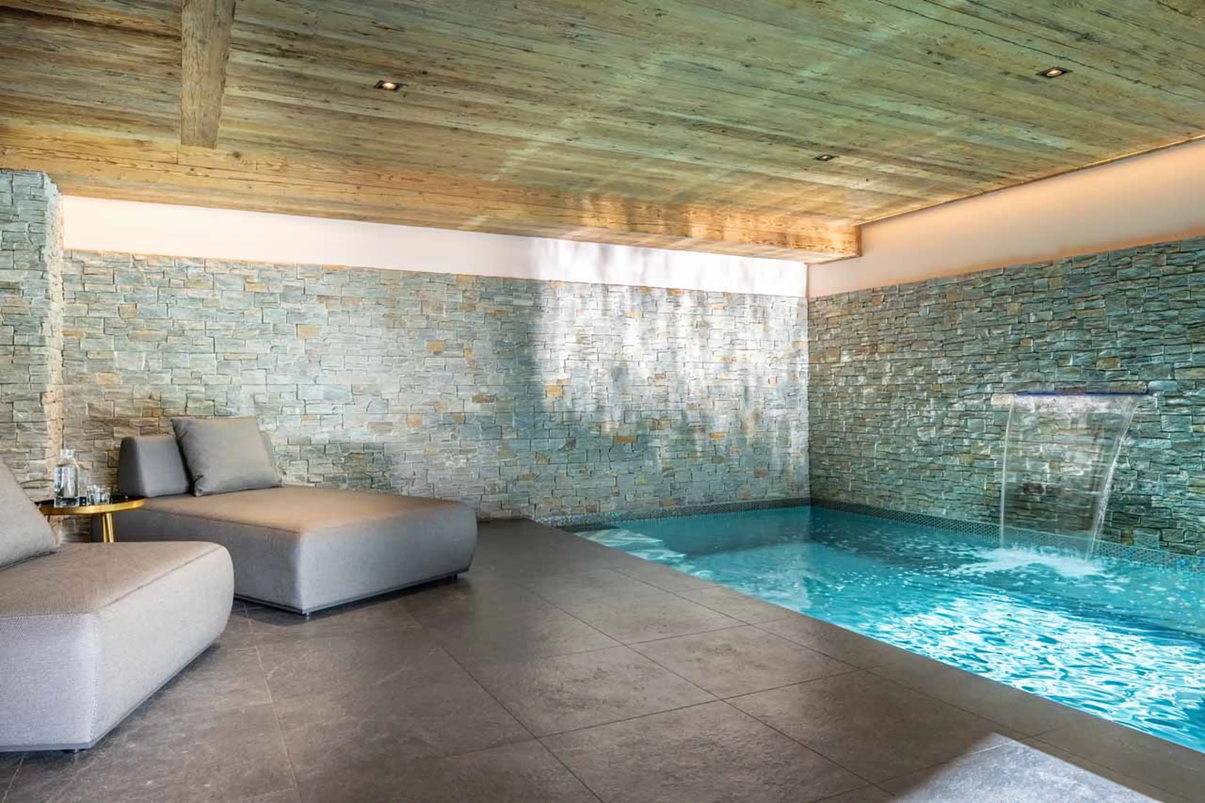 Relaxation area beside pool in Chalet Sirocco in Verbier