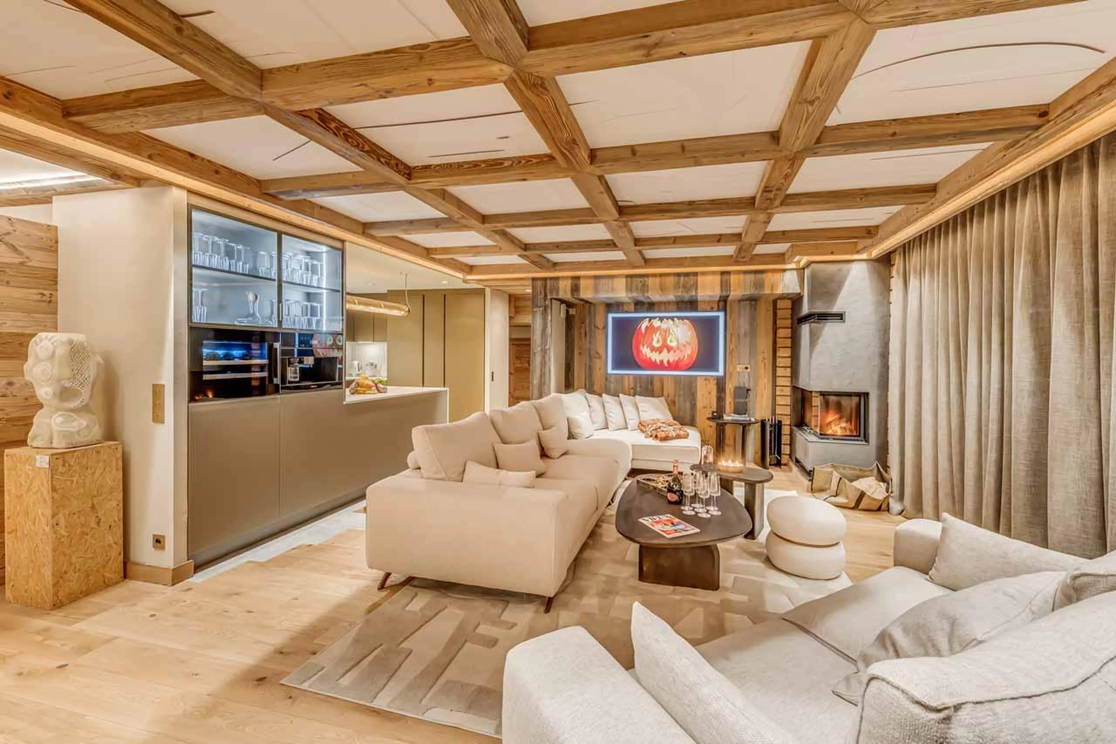 Sitting area and kitchen in Chalet Sneg, Tignes