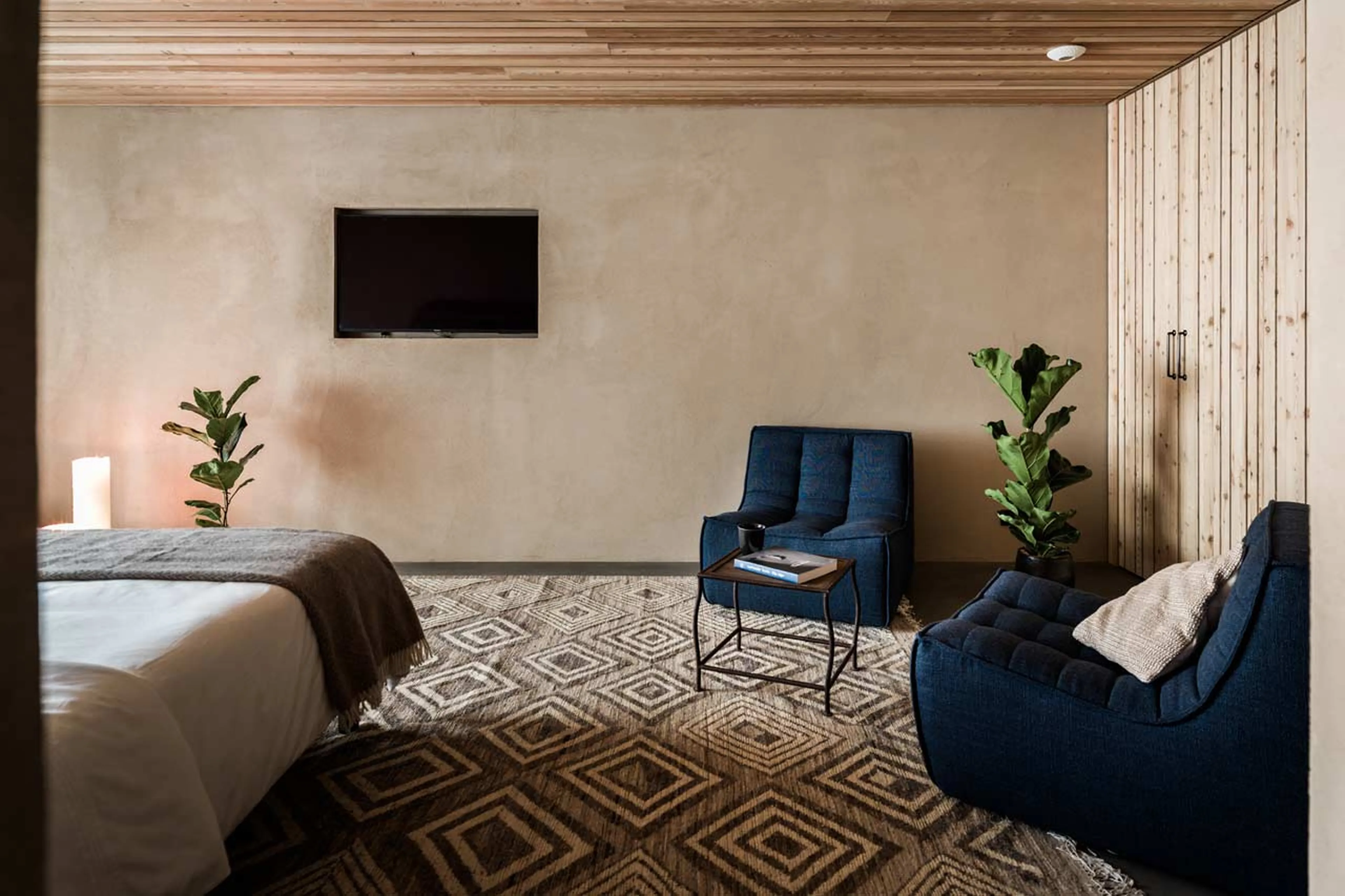 TV and seating area in bedroom one at Chalet Sundara in Chamonix