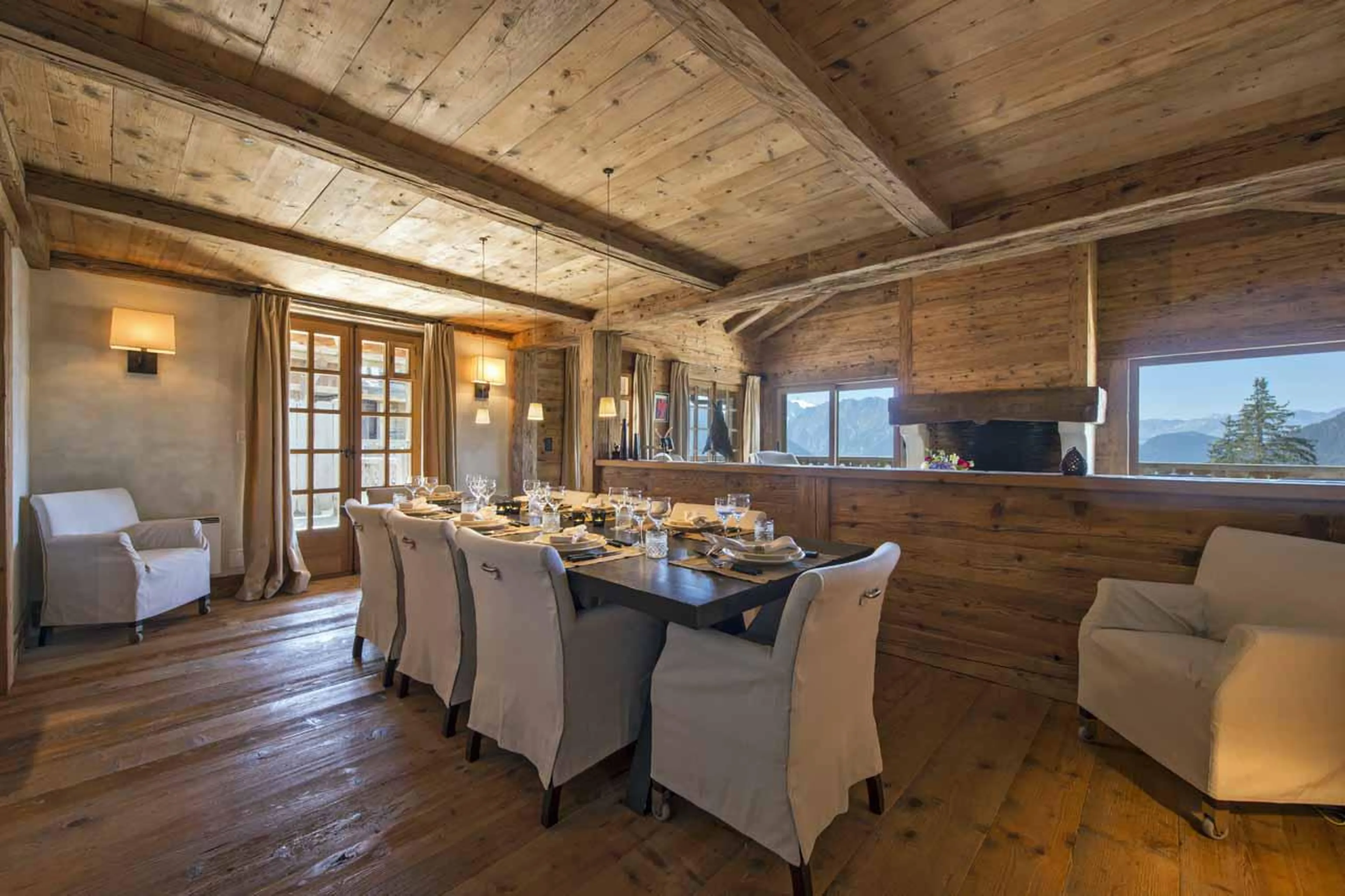 Dining table and terrace access at Chalet Tesseln in Verbier