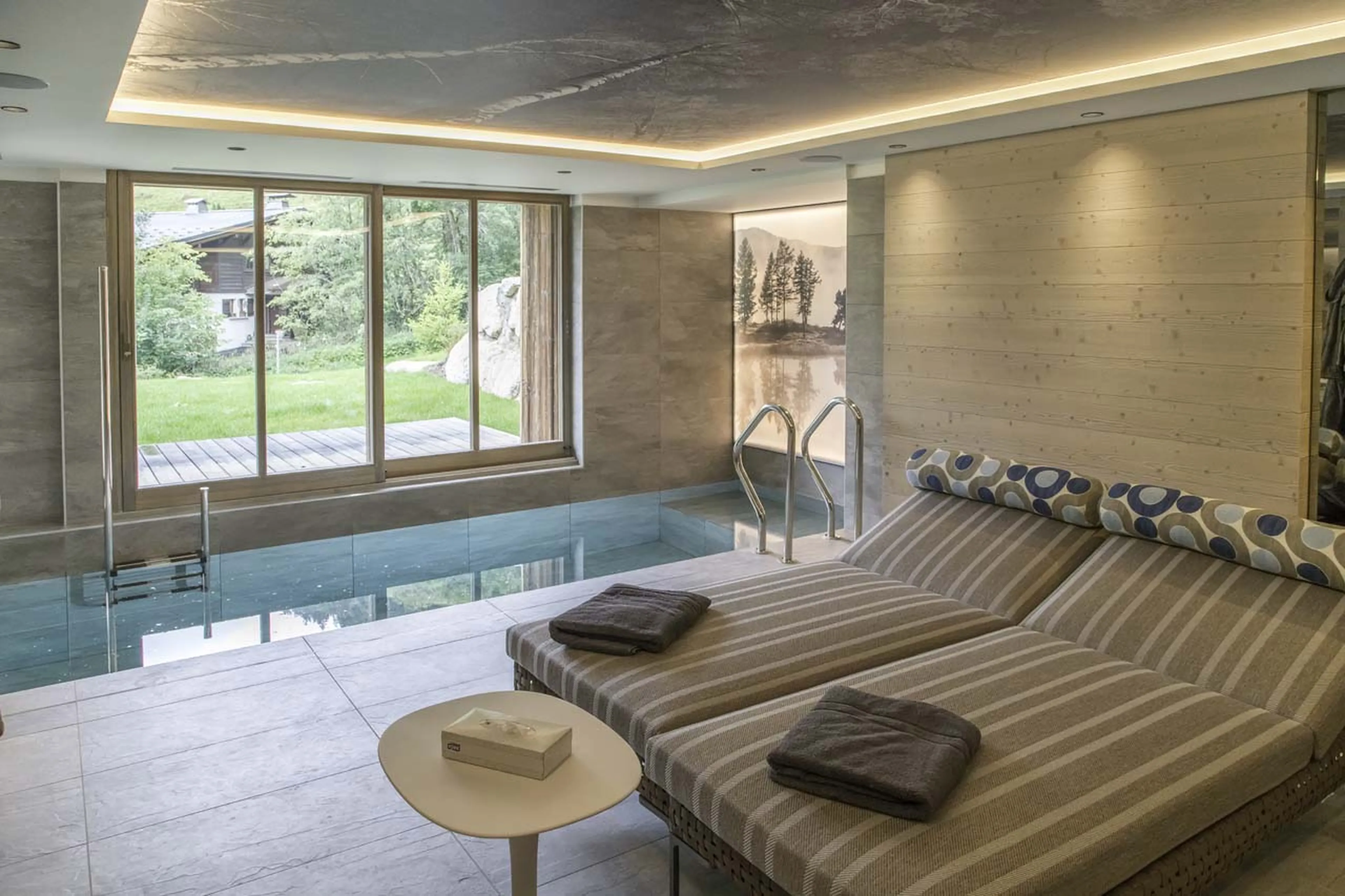 Relaxation beside pool at Chalet Thanasis in Megeve