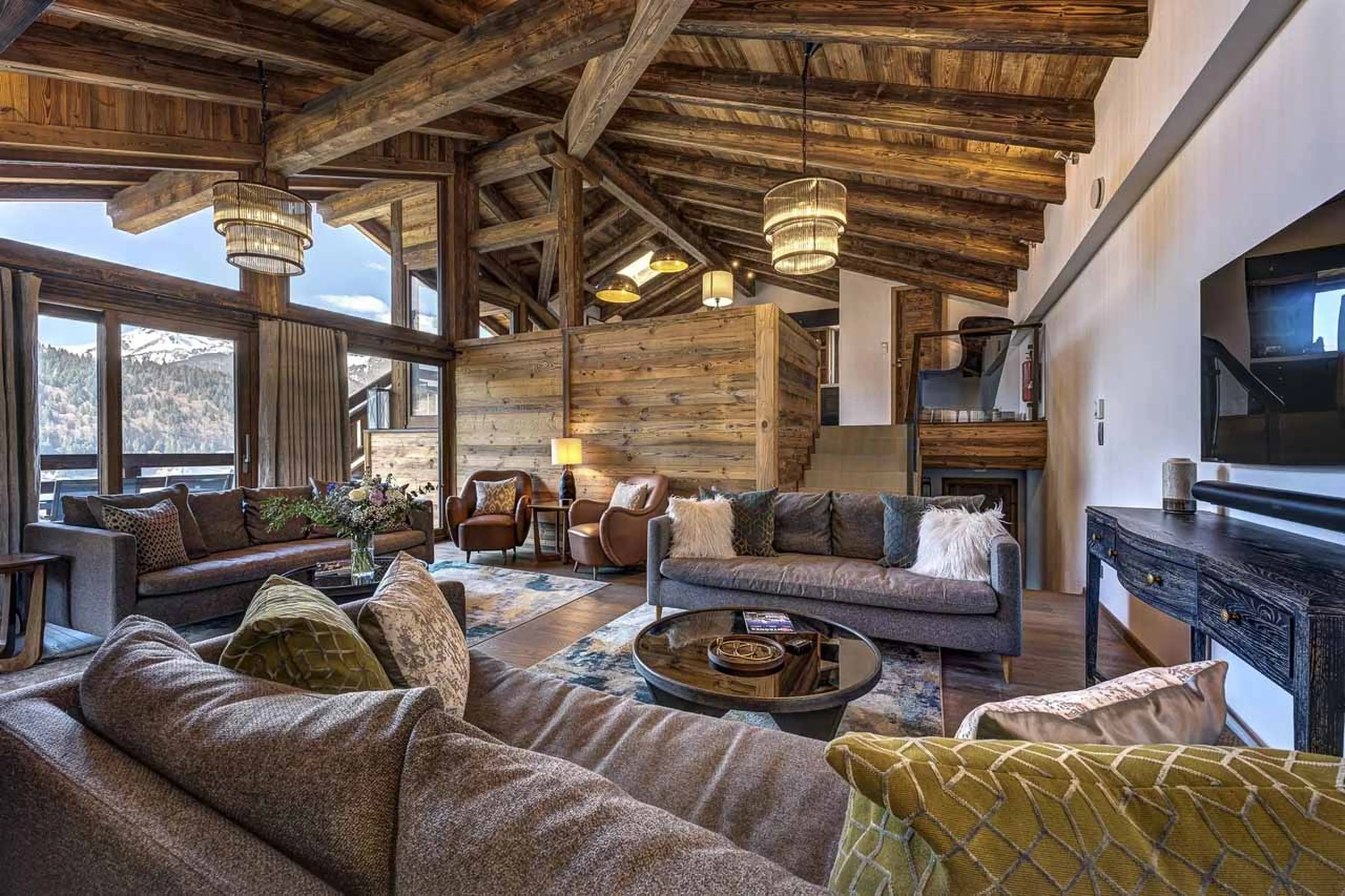 Fireplace and TV in living area of Chalet Three Bears in Morzine