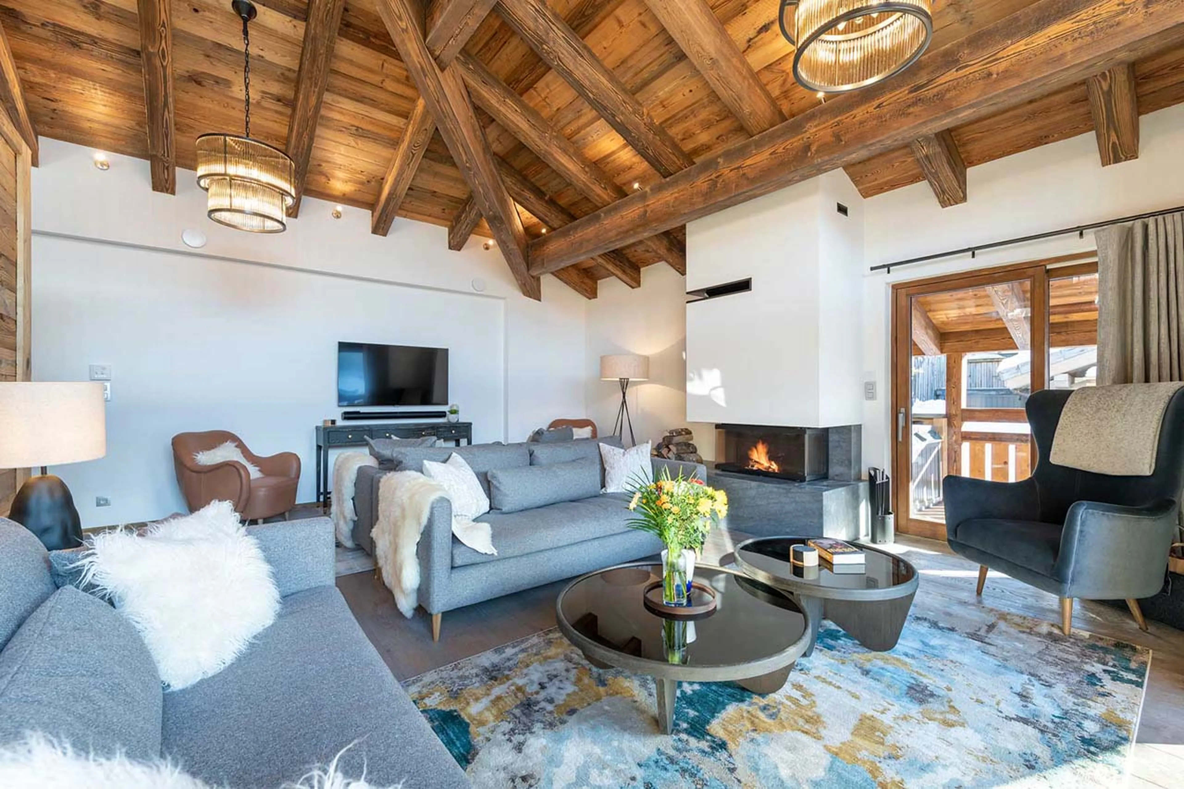 Fireplace and TV in living area of Chalet Three Bears in Morzine