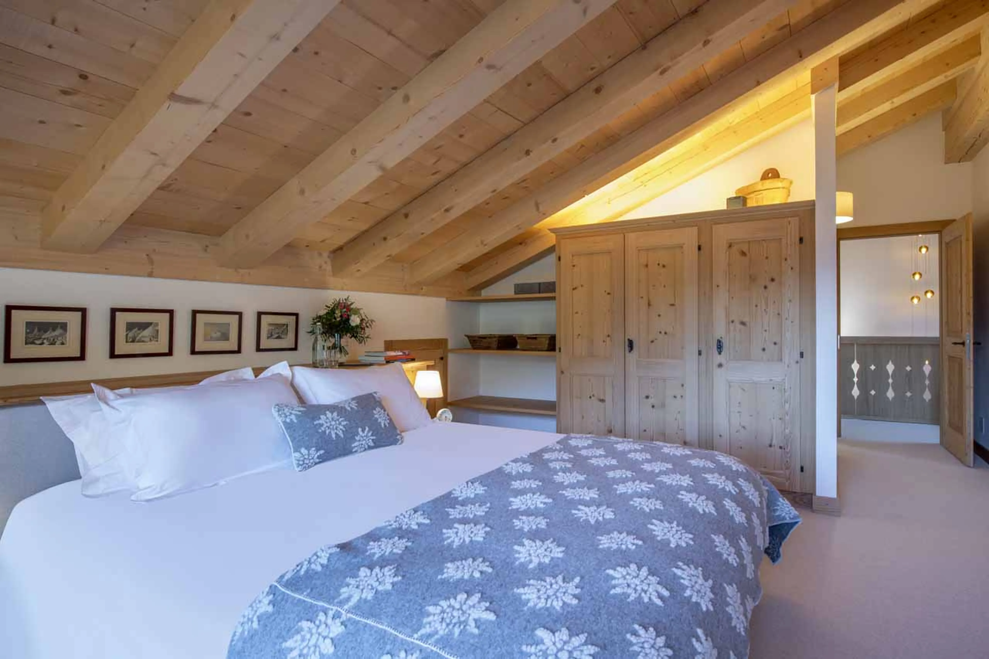 Master bedroom under the eaves at Chalet Tire Bouchon in Verbier