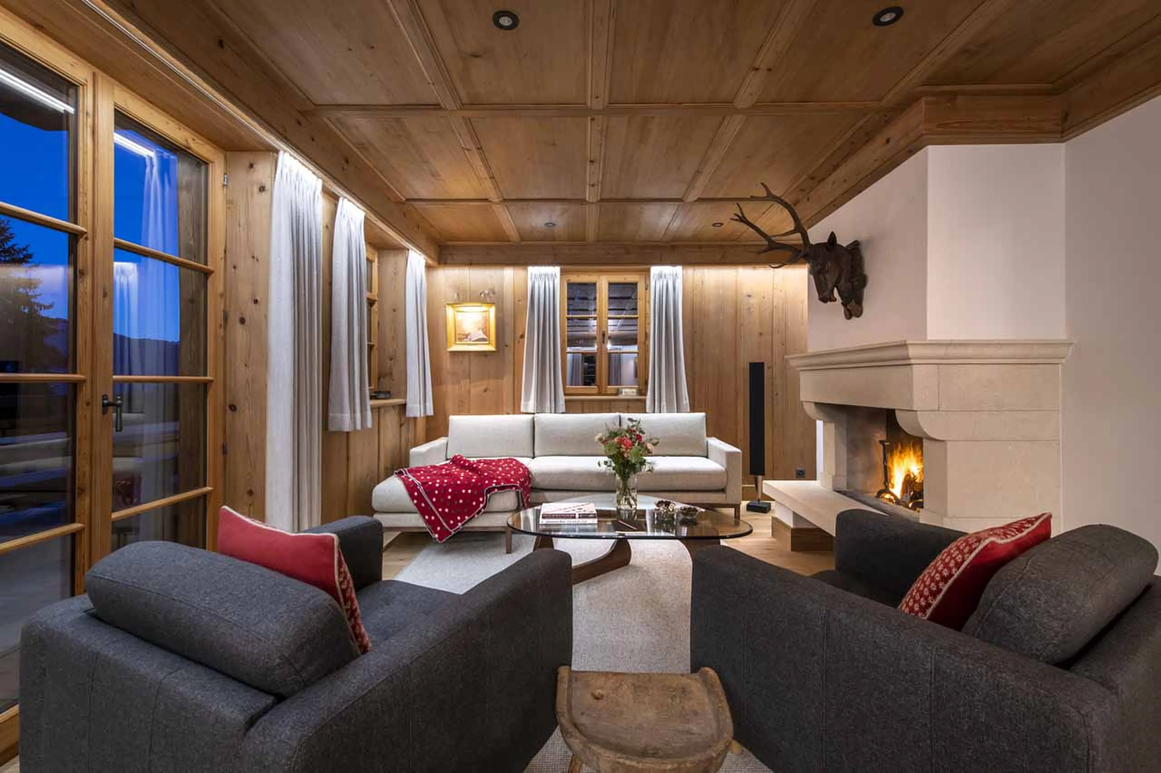 Living room at night at Chalet Tire Bouchon in Verbier