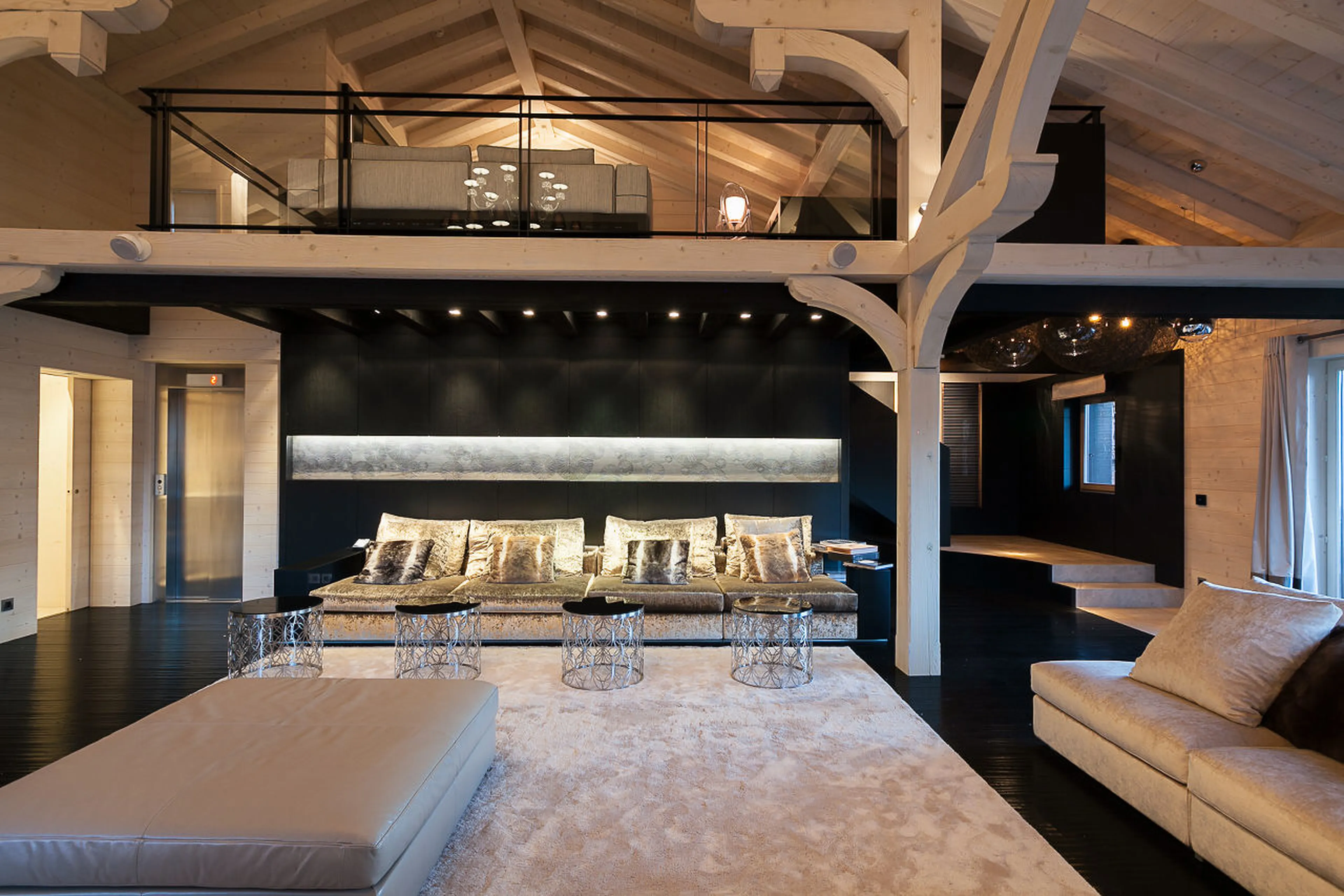 Mezzanine floor with TV and study above lounge area of Chalet Tobenjofi in Courchevel 1850