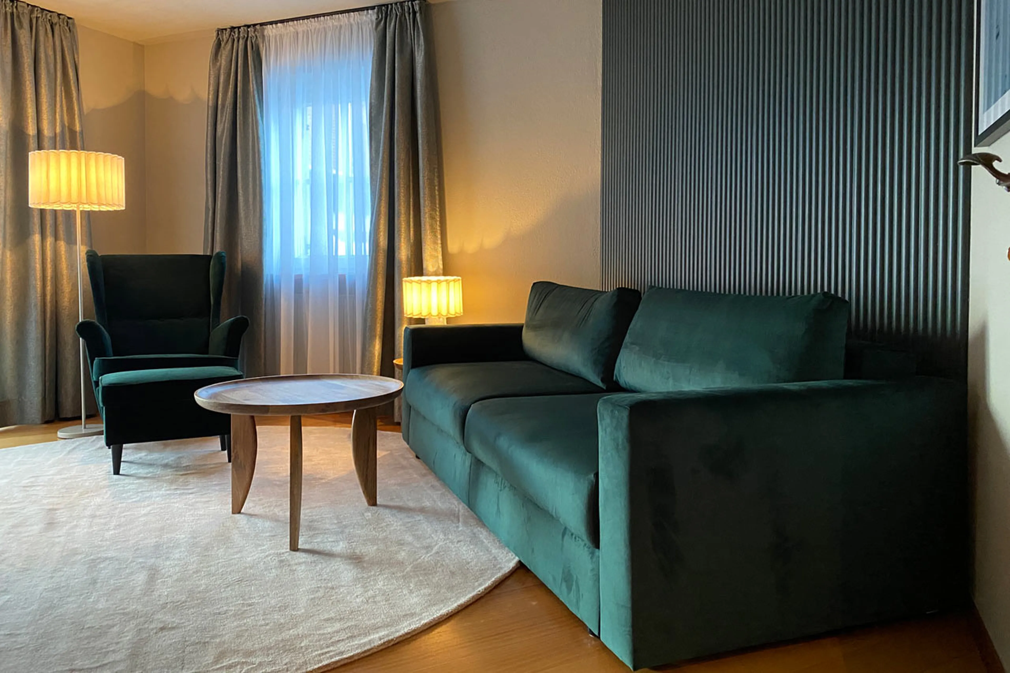 Pull-out couch in TV room of Chalet Toda in Lech