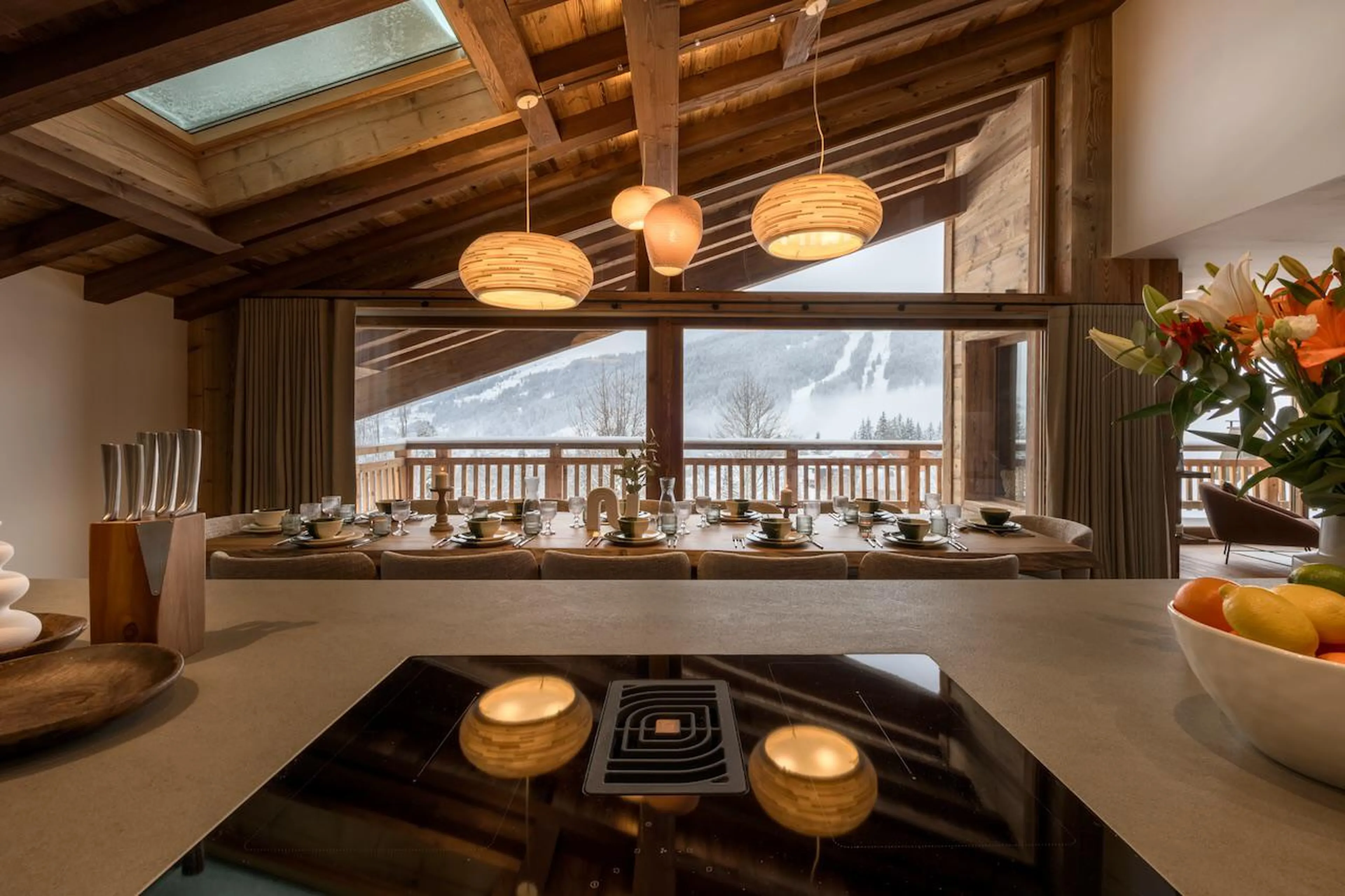 Modern kitchen overlooking panoramic mountain views at Chalet Tosca in Les Gets