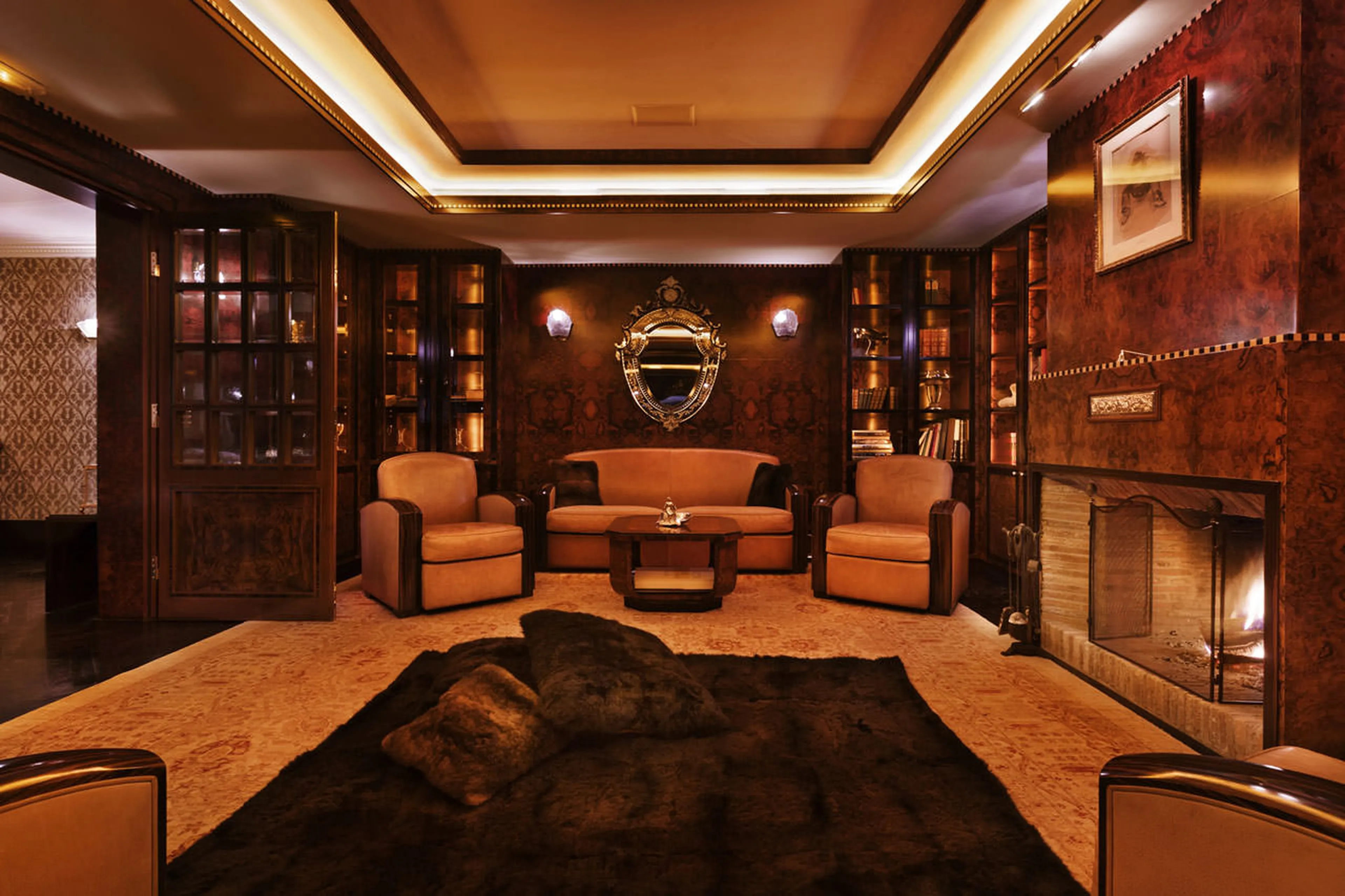 Fireplace in library/cigar lounge of Chalet Truffe Blanche in Verbier