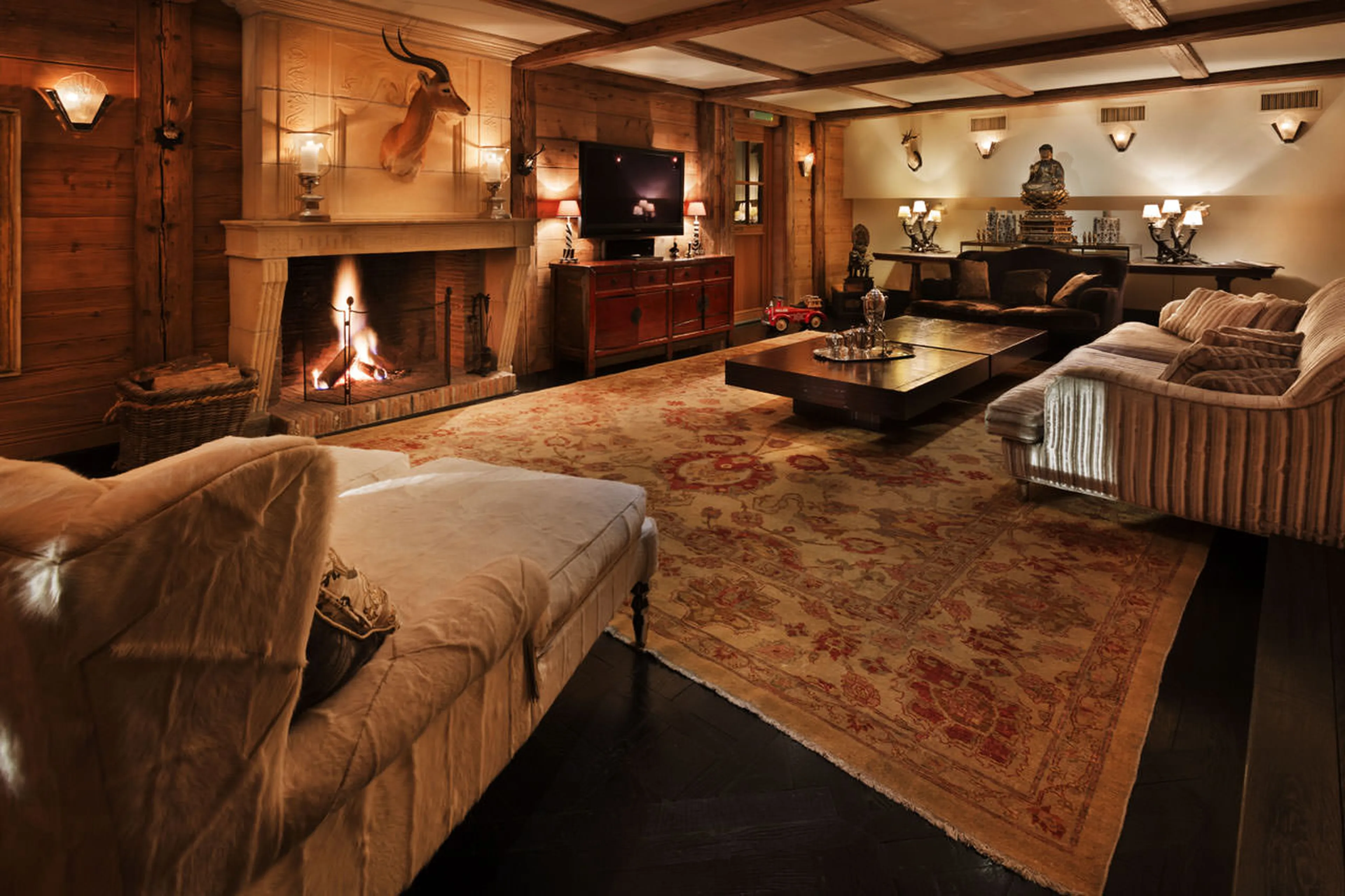 Fireplace and TV in living room of Chalet Truffe Blanche in Verbier